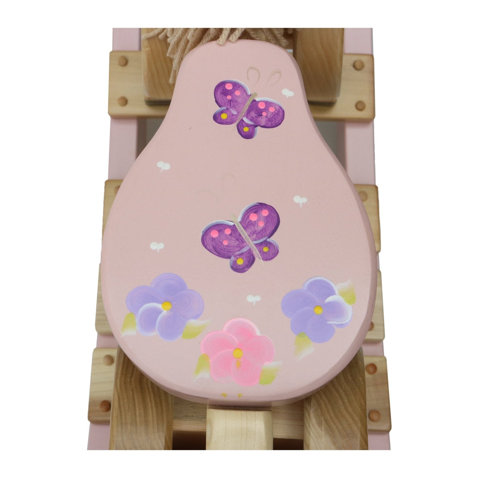 Close-up of pink seat with floral and butterfly design