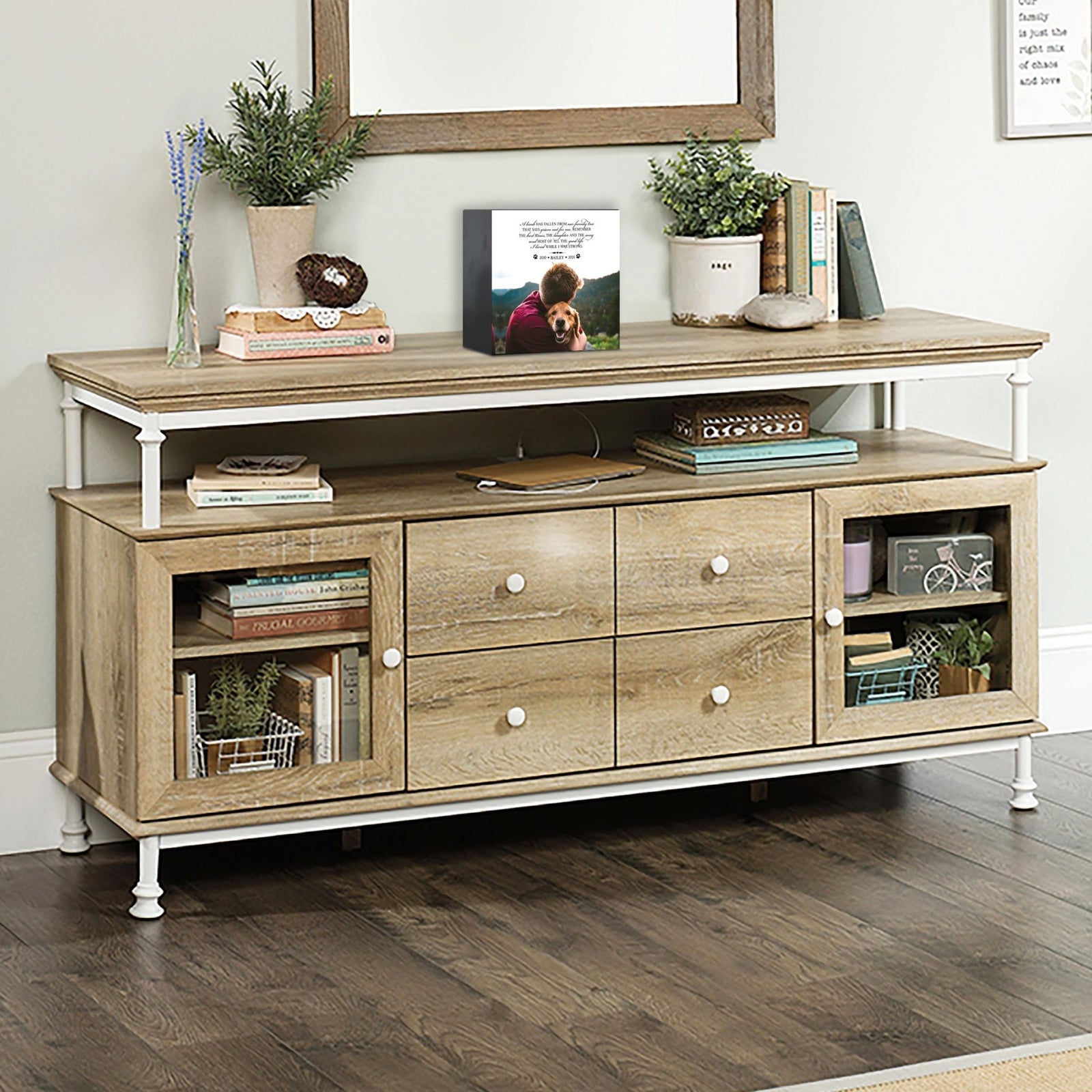 Wooden pet urn shadow box displayed on a rustic wooden TV console in a cozy living room. The shadow box features a custom photo of a pet. A touching bereavement keepsake box ideal for memorial shadow box ideas and personalized pet urns for ashes.