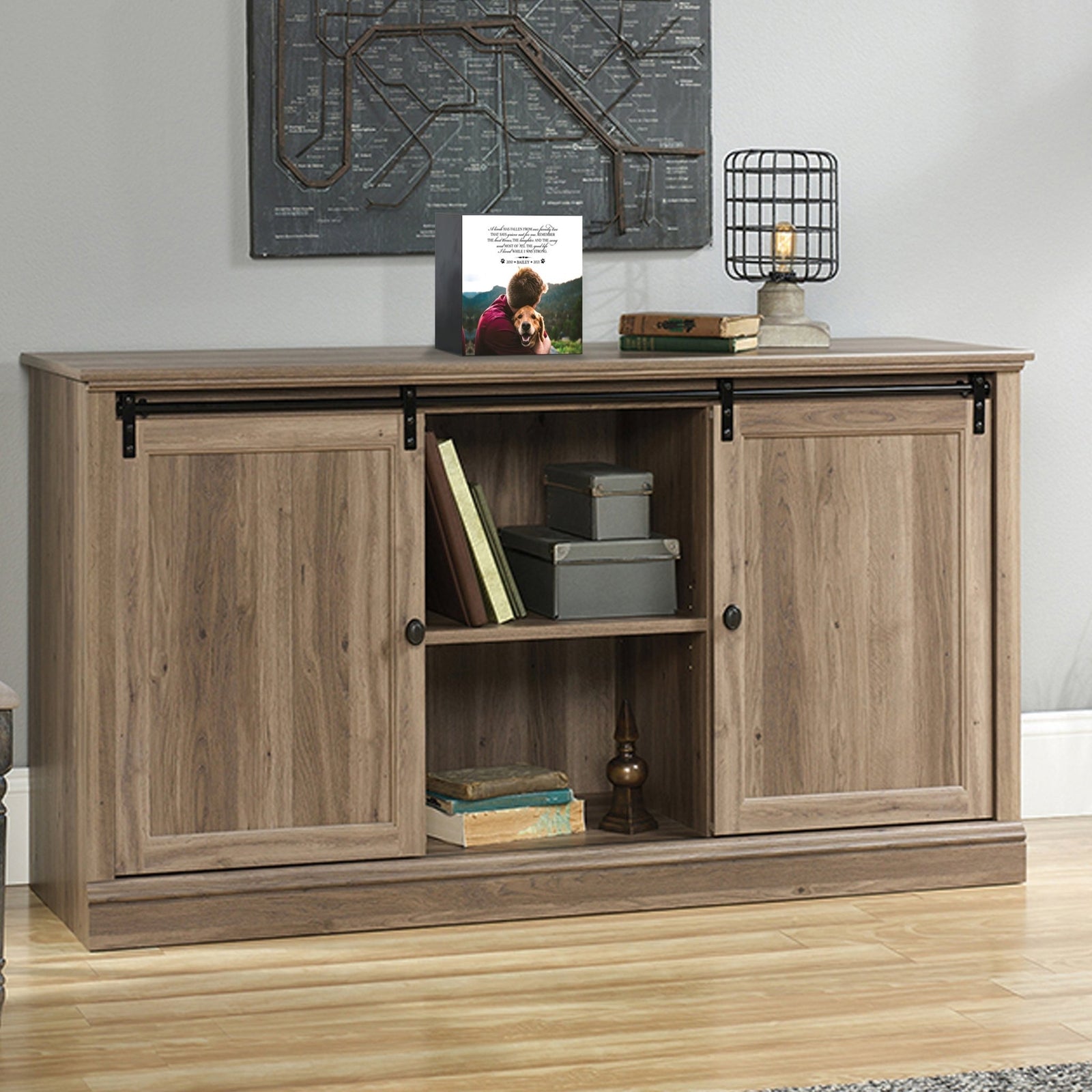 Custom wooden pet urn shadow box displayed on a rustic wooden cabinet in a cozy living room. The personalized pet memorial shadow box features a customized photo of a pet and a heartfelt message. A perfect bereavement keepsake box and sympathy gift for honoring the loss of a beloved pet, blending warmth and sentiment with home décor.