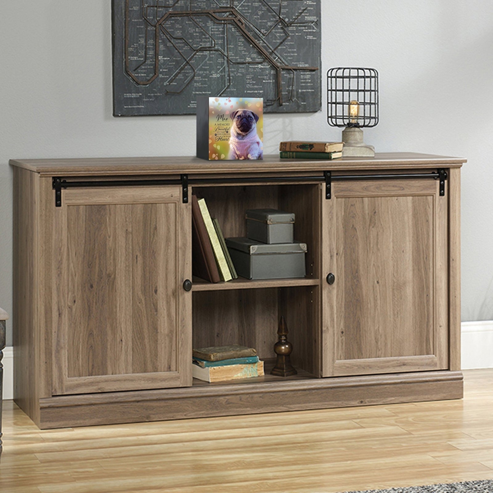 Custom wooden pet urn shadow box displayed on a rustic wooden cabinet in a cozy living room. The personalized pet memorial shadow box features a customized photo of a pet and a heartfelt message. A perfect bereavement keepsake box and sympathy gift for honoring the loss of a beloved pet, blending warmth and sentiment with home décor.