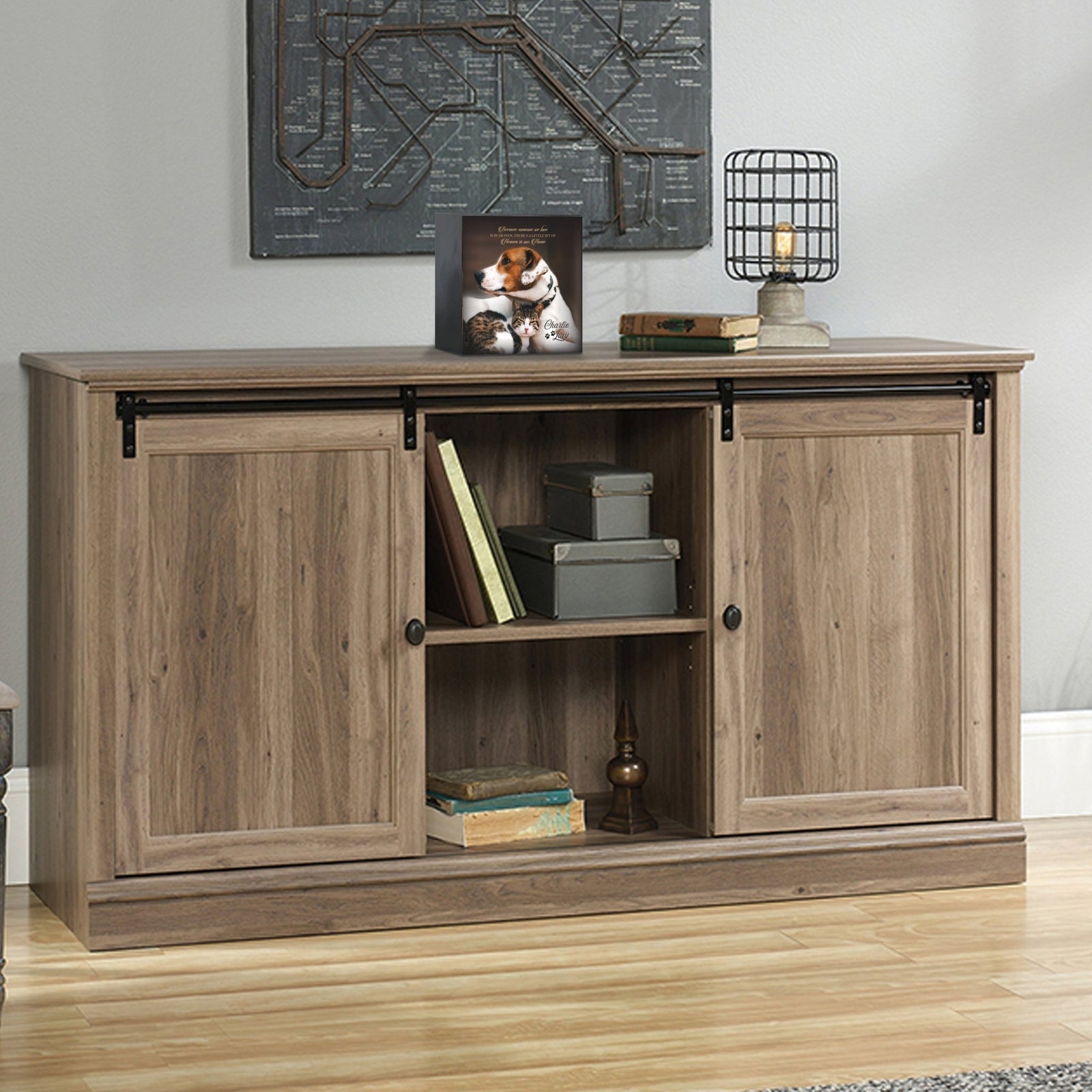 Custom wooden pet urn shadow box displayed on a rustic wooden cabinet in a cozy living room. The personalized pet memorial shadow box features a customized photo of a pet and a heartfelt message. A perfect bereavement keepsake box and sympathy gift for honoring the loss of a beloved pet, blending warmth and sentiment with home décor.