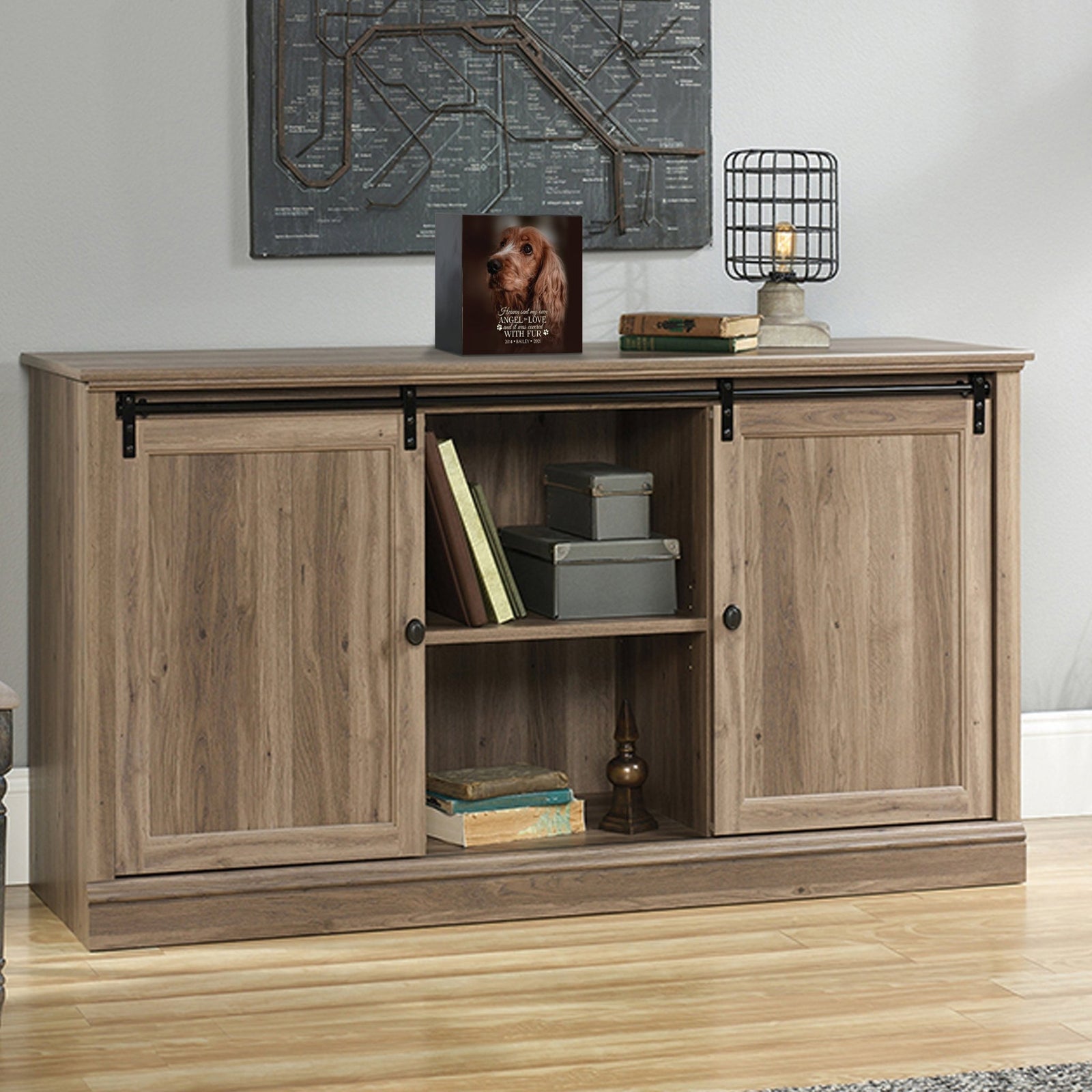 Custom pet cremation urns for ashes displayed on a stylish console table.