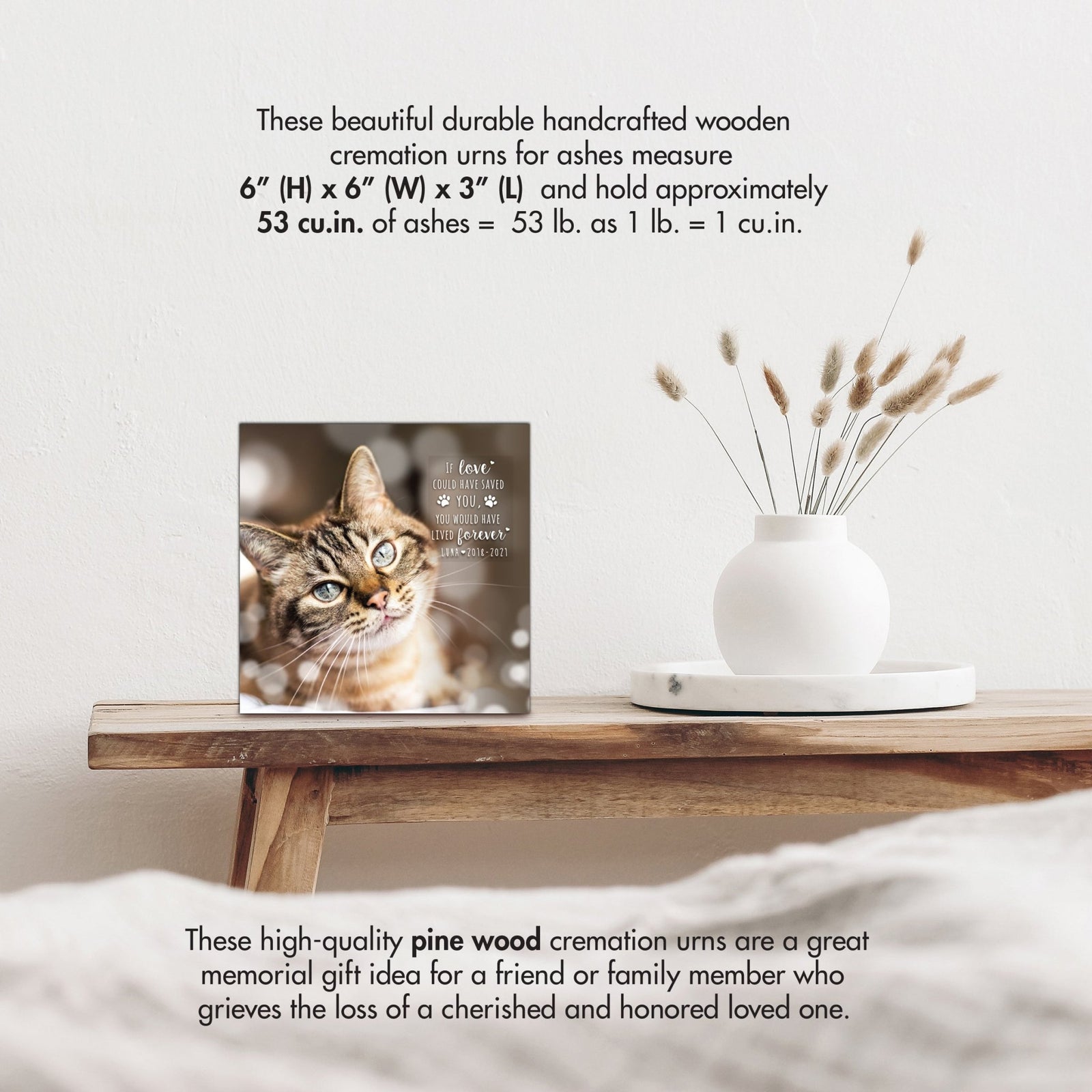 Wooden pet urn shadow box by Lifesong Milestones displayed on a rustic wooden table with a white vase of pampas grass.