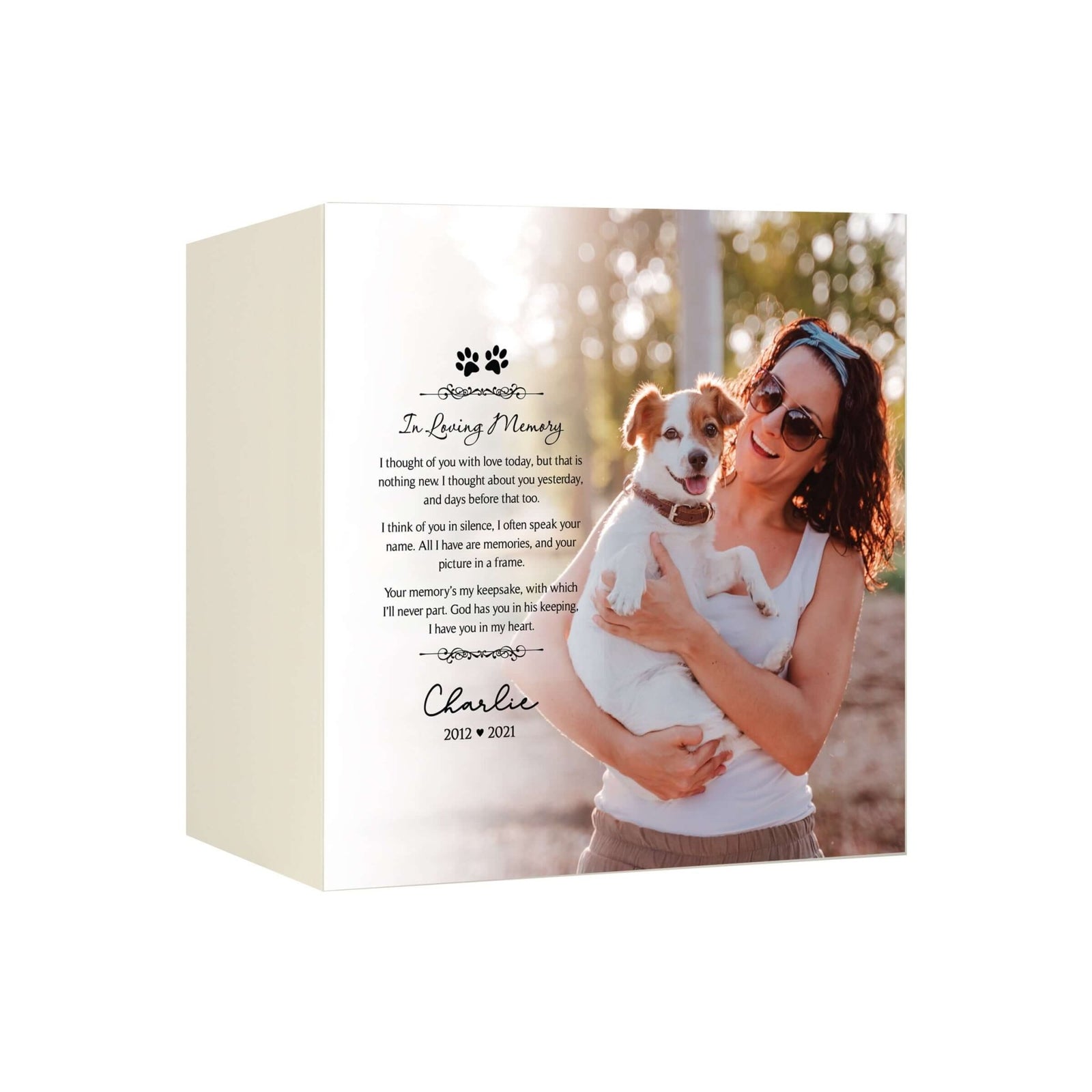 A pet cremation urn for dogs, featuring a woman holding her dog, along with a poem and name, creating a heartfelt remembrance piece.