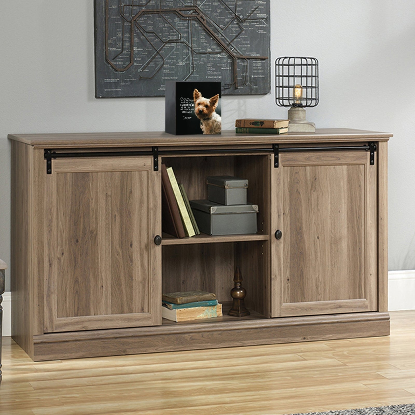 Custom wooden pet urn shadow box displayed on a rustic wooden cabinet in a cozy living room. The personalized pet memorial shadow box features a customized photo of a pet and a heartfelt message. A perfect bereavement keepsake box and sympathy gift for honoring the loss of a beloved pet, blending warmth and sentiment with home décor.