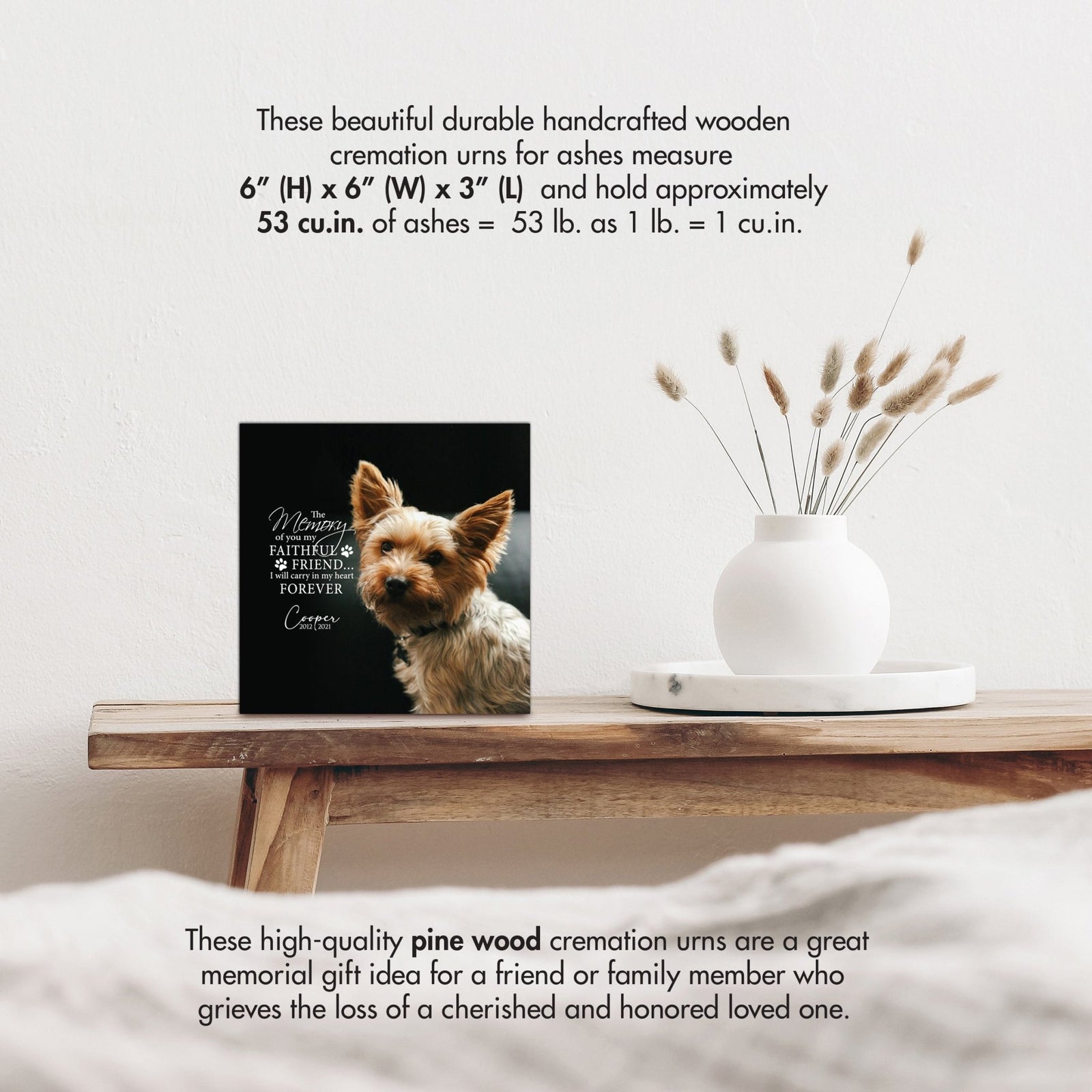 Wooden pet urn shadow box by Lifesong Milestones displayed on a rustic wooden table with a white vase of pampas grass, showcasing a custom photo of Bella with the heartfelt message. Ideal for memorial shadow box ideas or personalized pet urns for ashes