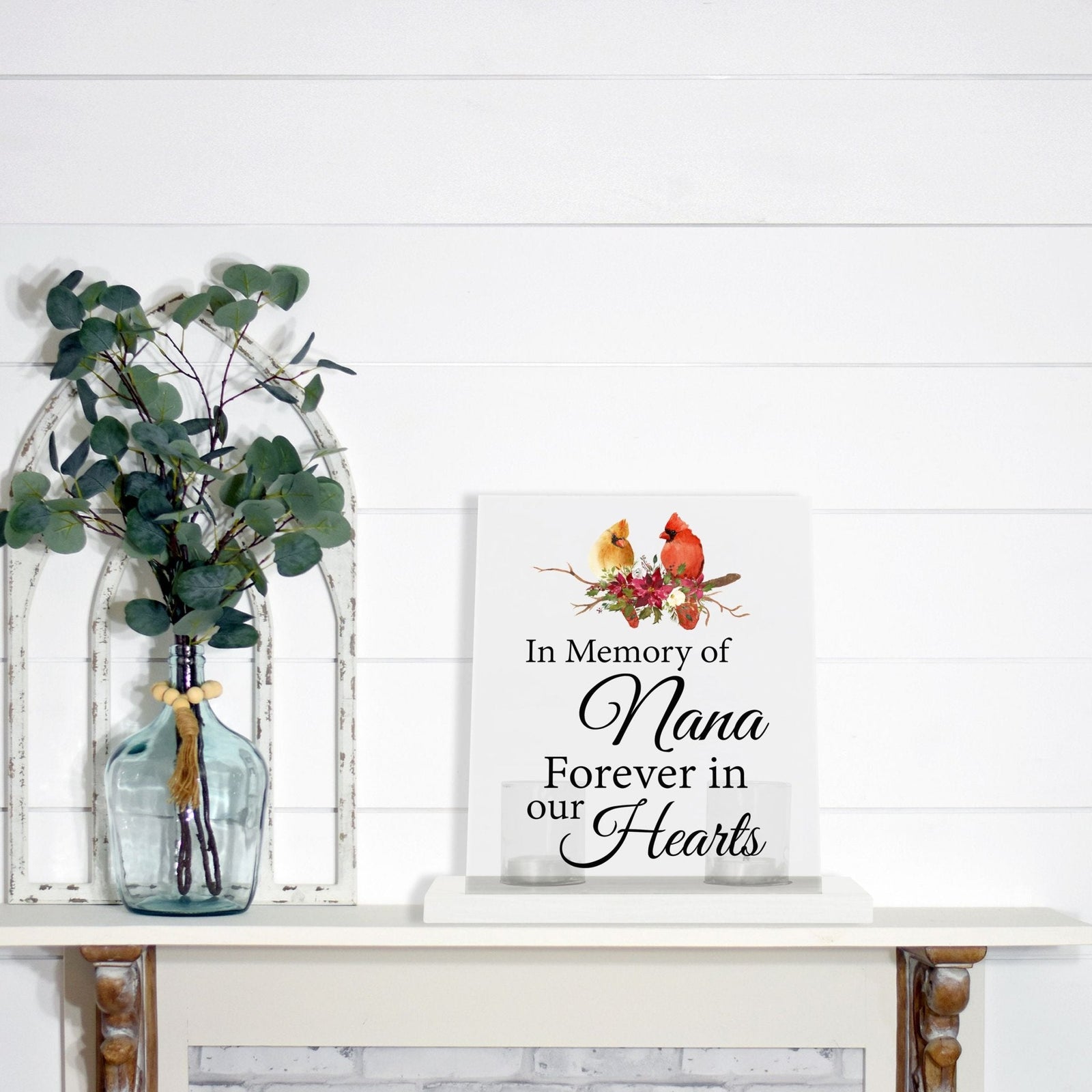 A beautifully crafted candle holder for votive candles, designed as a memorial gift. The Lifesong Milestones Cardinal Memorial Frosted Acrylic Sign with Base stands at the center, radiating comfort and remembrance.