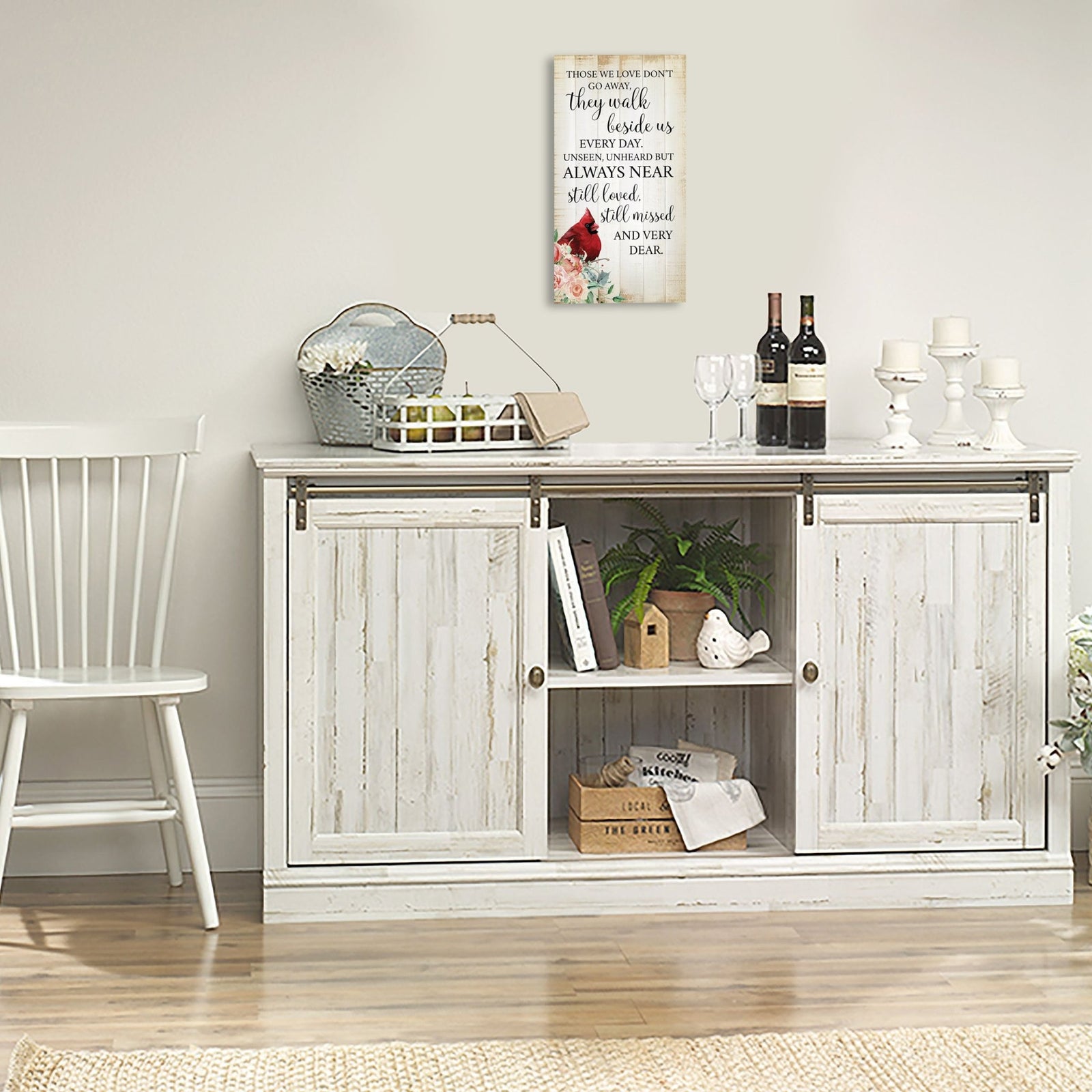 A wooden memorial wall plaque featuring a cardinal, a symbol of remembrance and love.