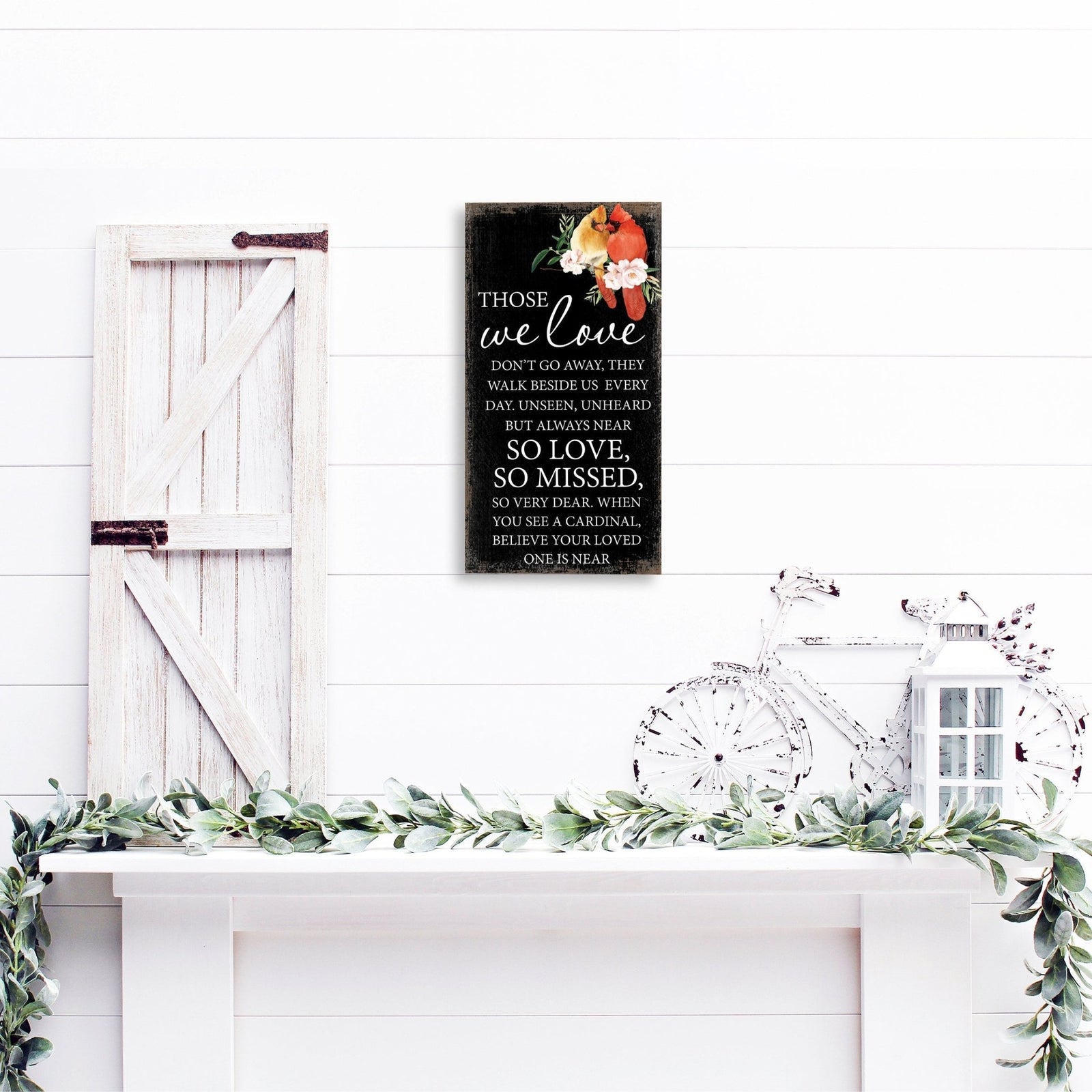 A wooden memorial wall plaque featuring a cardinal, a symbol of remembrance and love.