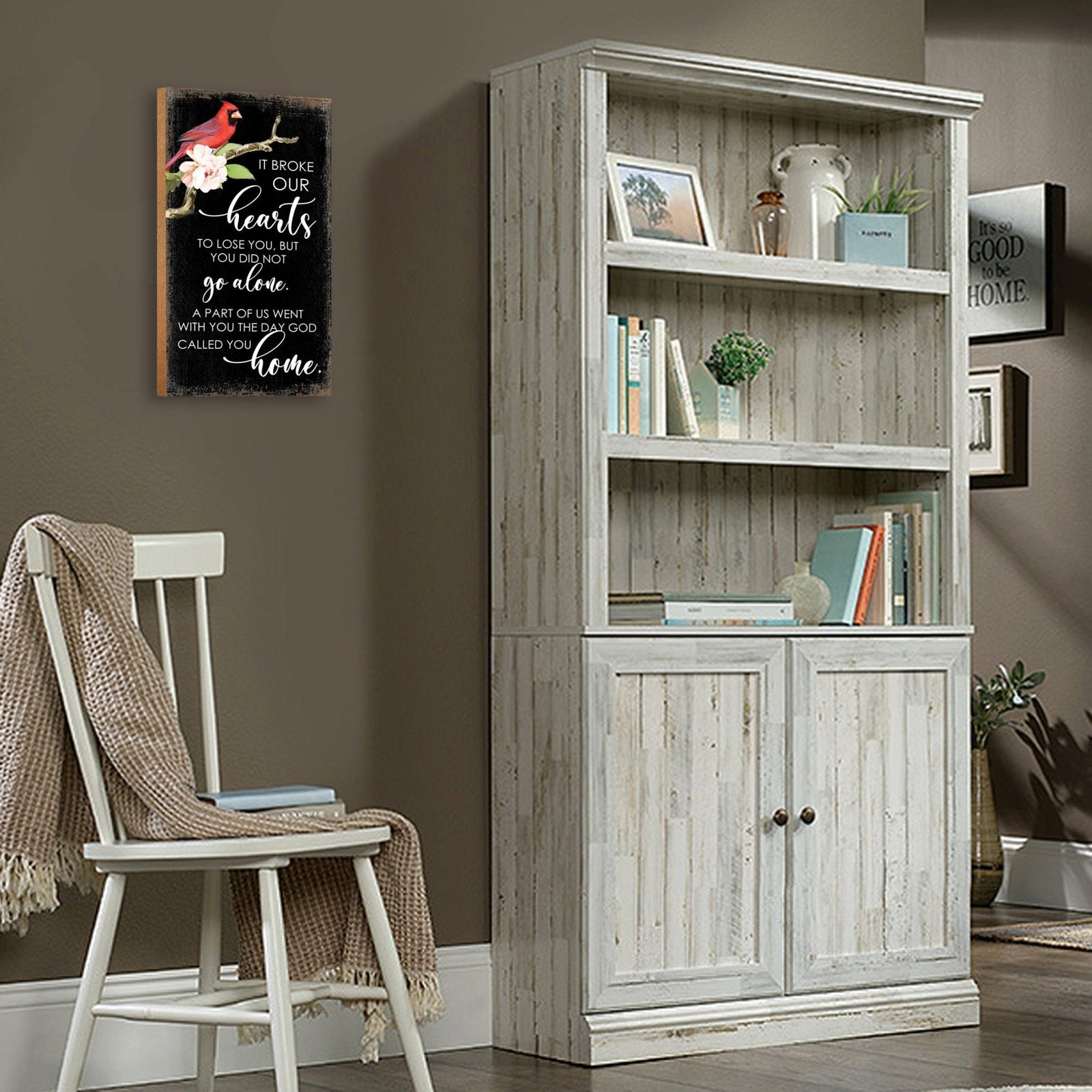 A wooden memorial wall plaque featuring a cardinal, a symbol of remembrance and love.