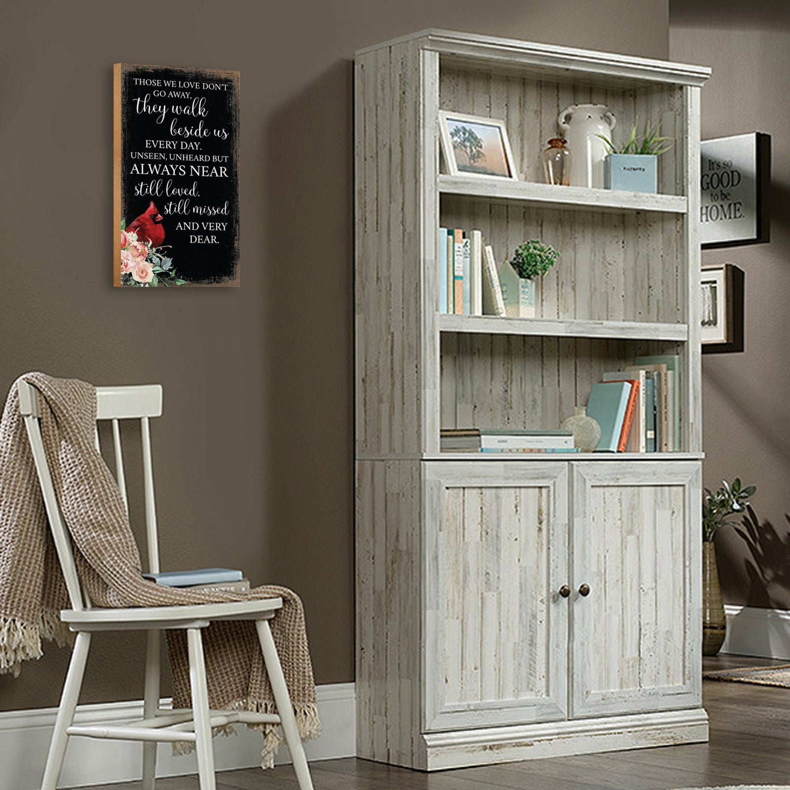 A wooden memorial wall plaque featuring a cardinal, a symbol of remembrance and love.