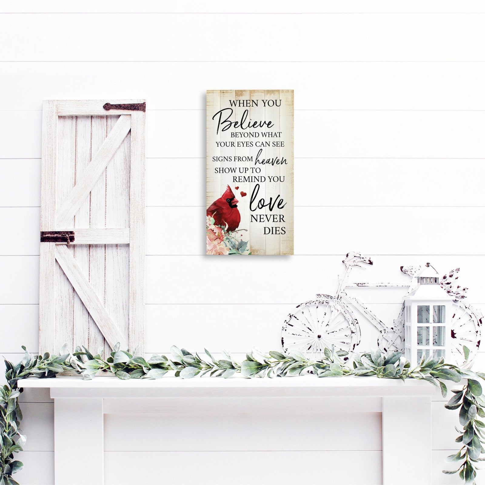 A wooden memorial wall plaque featuring a cardinal, a symbol of remembrance and love.