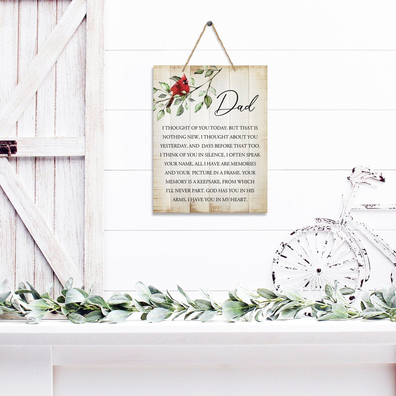 Thoughtful memorial gifts for the loss of a loved one – a wooden hanging sign adorned with a cardinal ribbon.