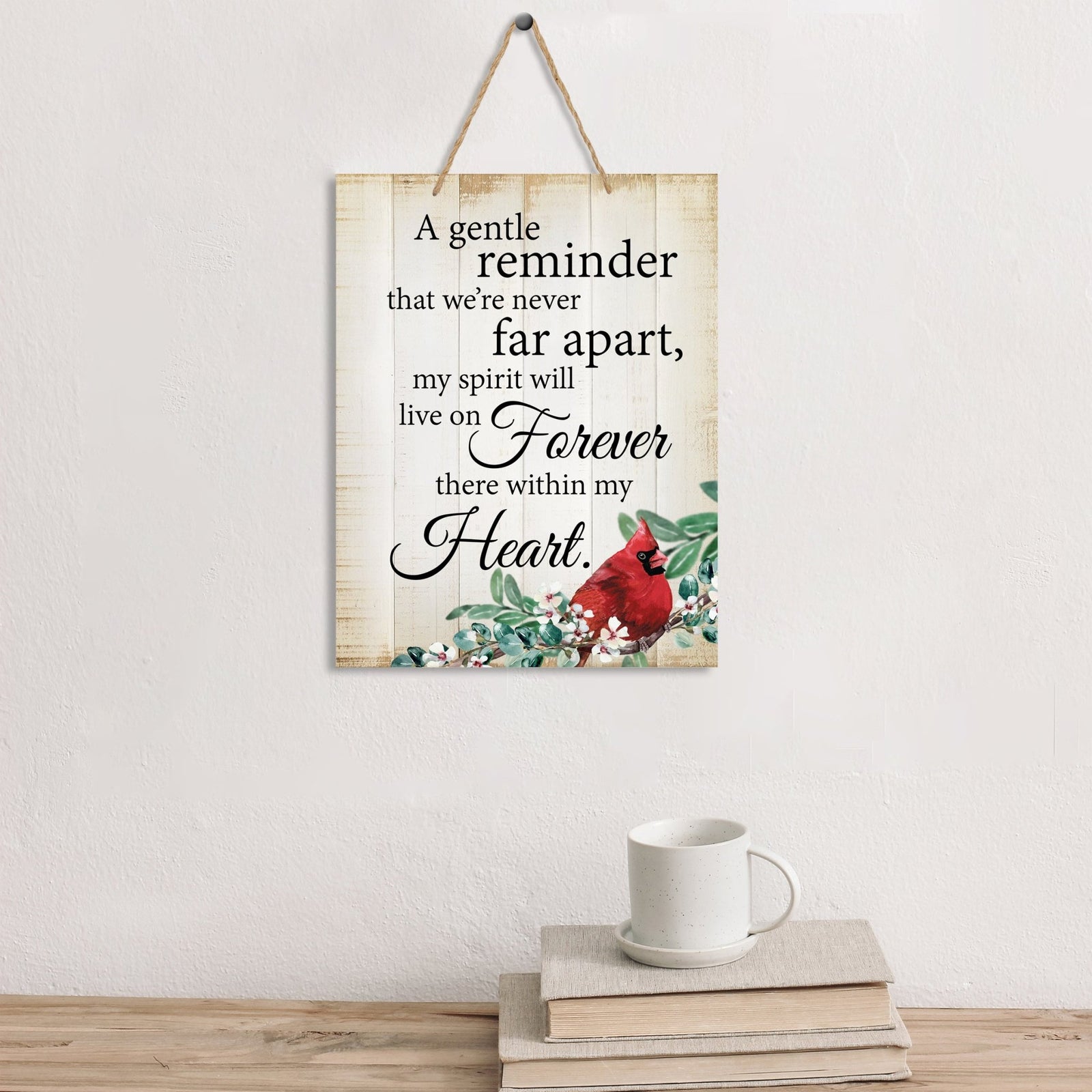 Thoughtful memorial gifts for the loss of a loved one – a wooden hanging sign adorned with a cardinal ribbon.