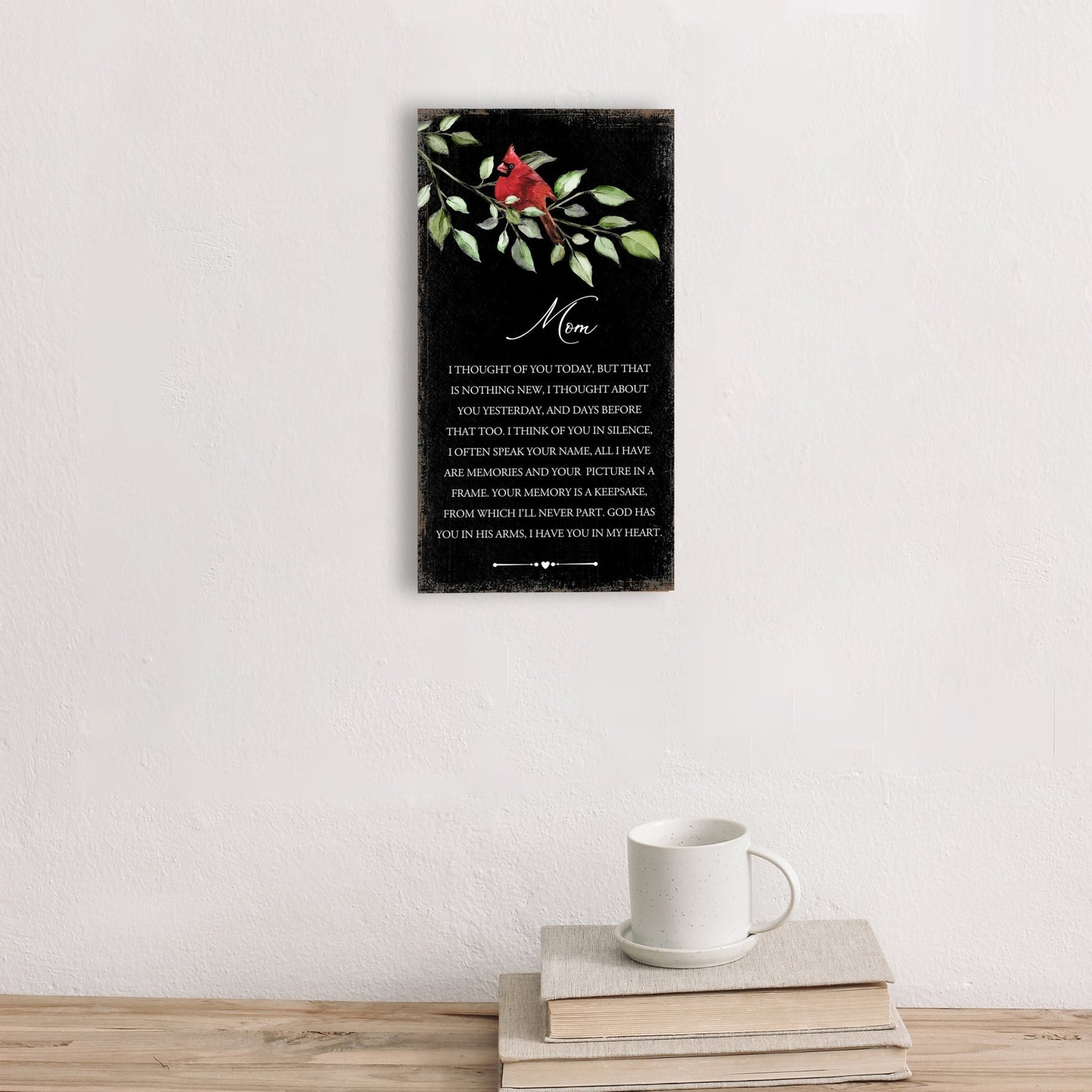 A wooden memorial wall plaque with a heartfelt design.