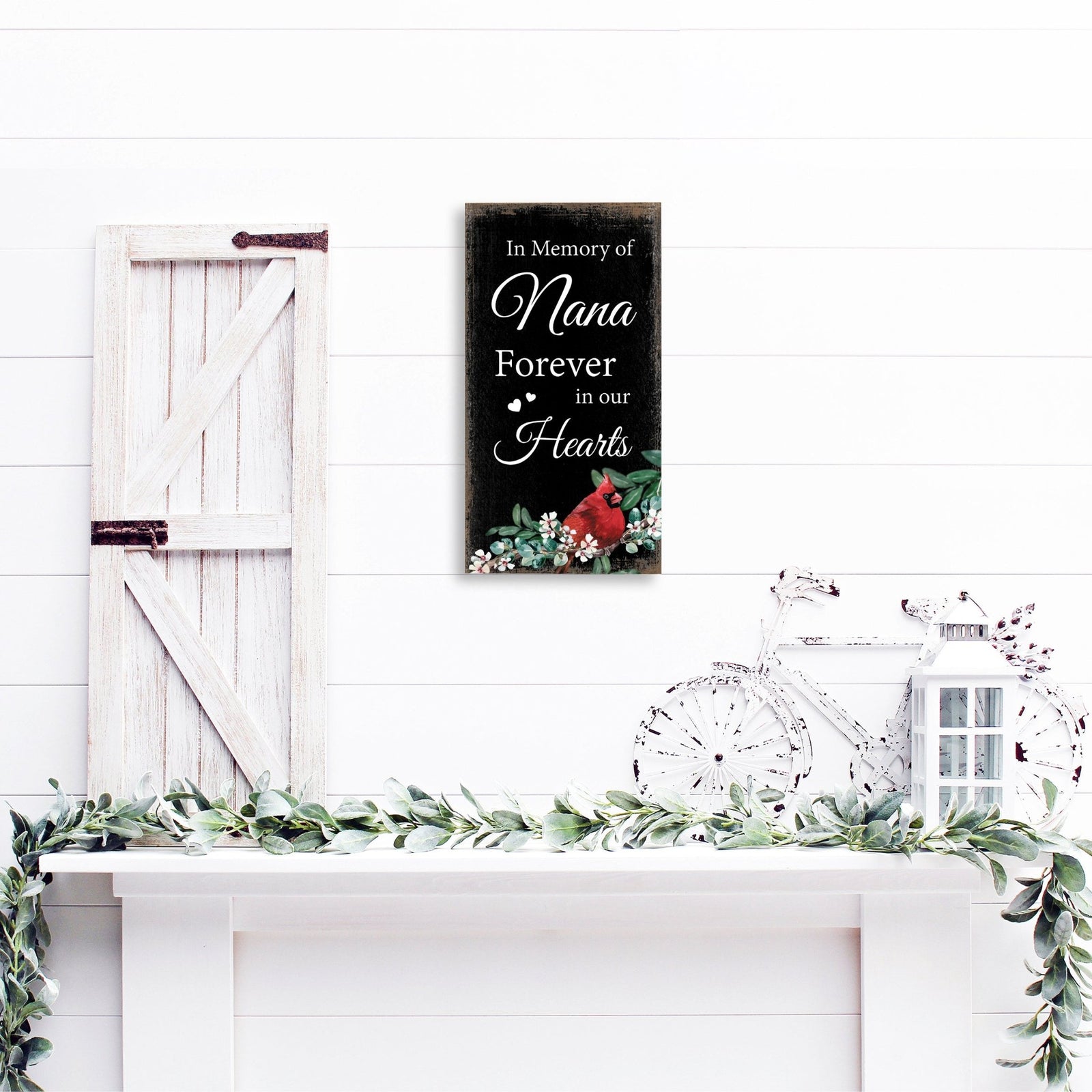 A wooden memorial wall plaque featuring a cardinal, a symbol of remembrance and love.