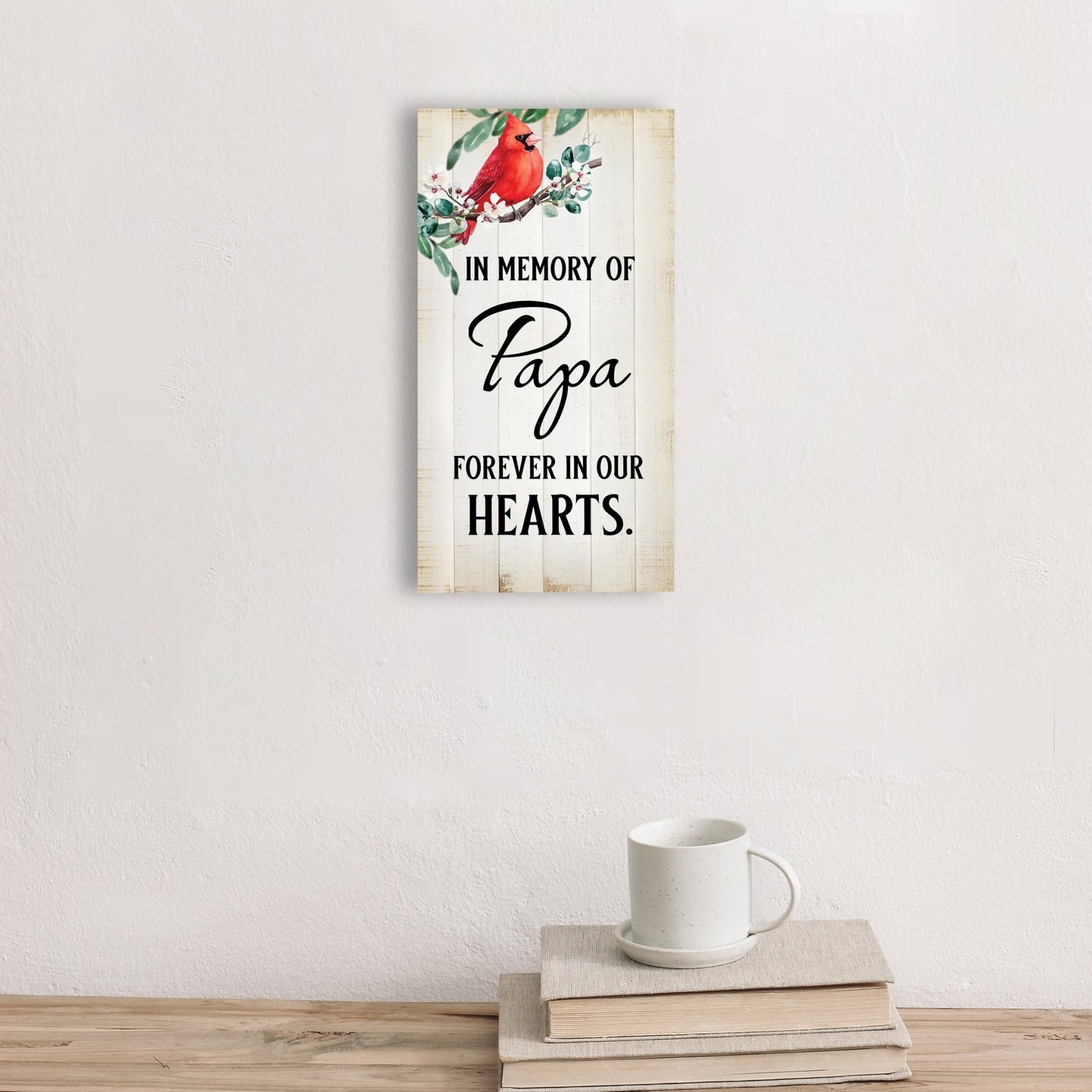 A wooden memorial wall plaque featuring a cardinal, a symbol of remembrance and love.