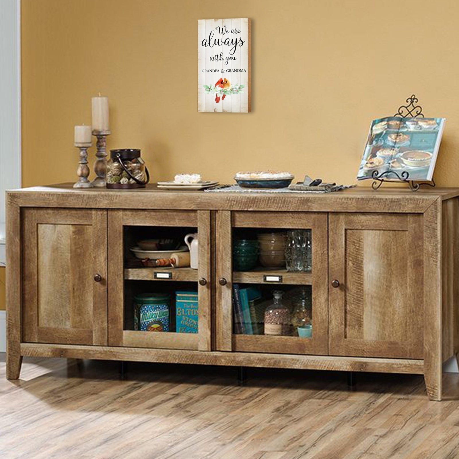 A wooden memorial wall plaque featuring a cardinal, a symbol of remembrance and love.