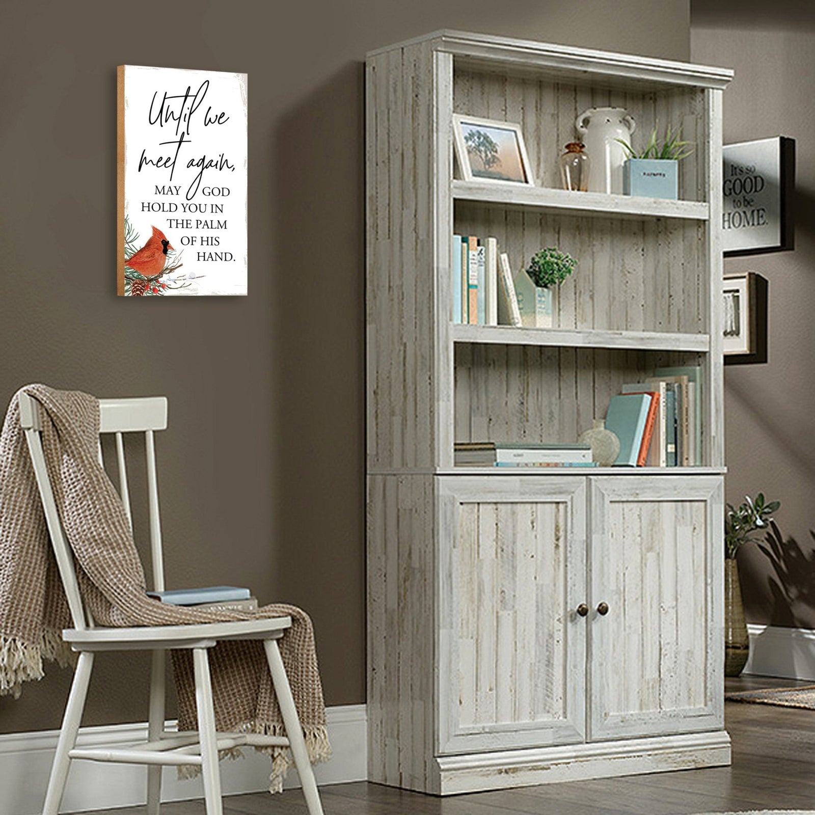 A wooden memorial wall plaque featuring a cardinal, a symbol of remembrance and love.