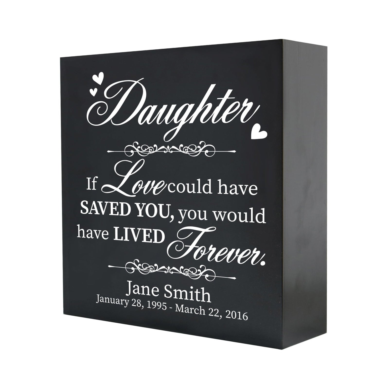 A close-up of a wooden shadow box urn for human ashes, crafted for adults, showcasing its sleek black finish and personalized white text memorializing a daughter. The detailed engraving reads, "If love could have saved you, you would have lived forever," offering a touching keepsake.