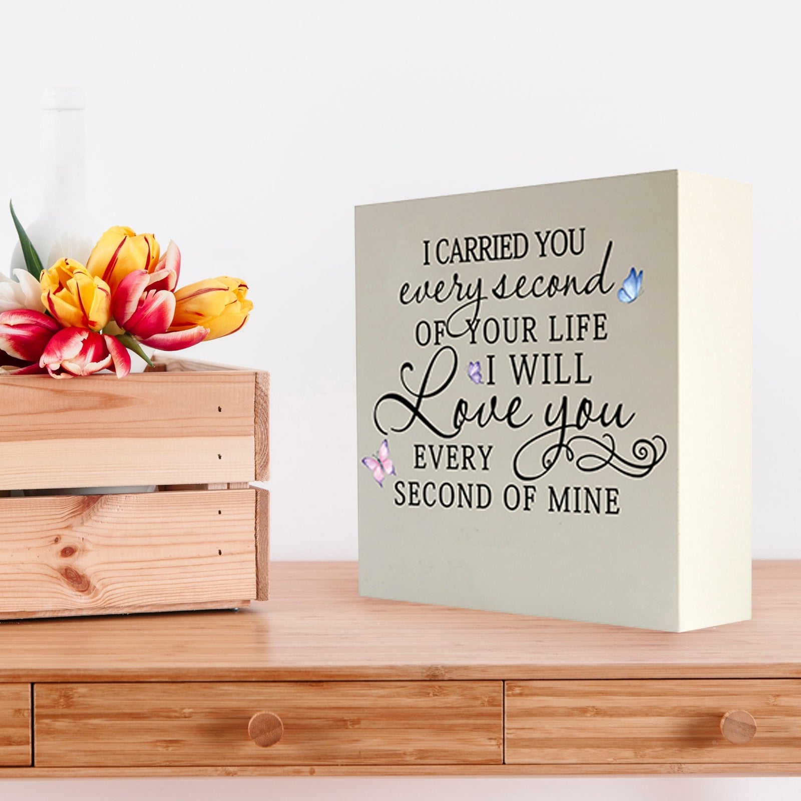 Lifesong Milestones Memorial Shadow Box Urn for human ashes, featuring a white wooden design with an elegant inscription reading, 'I carried you every second of your life, and I will love you every second of mine.' Beautifully decorated with colorful butterfly accents, perfect as a remembrance piece for loved ones.