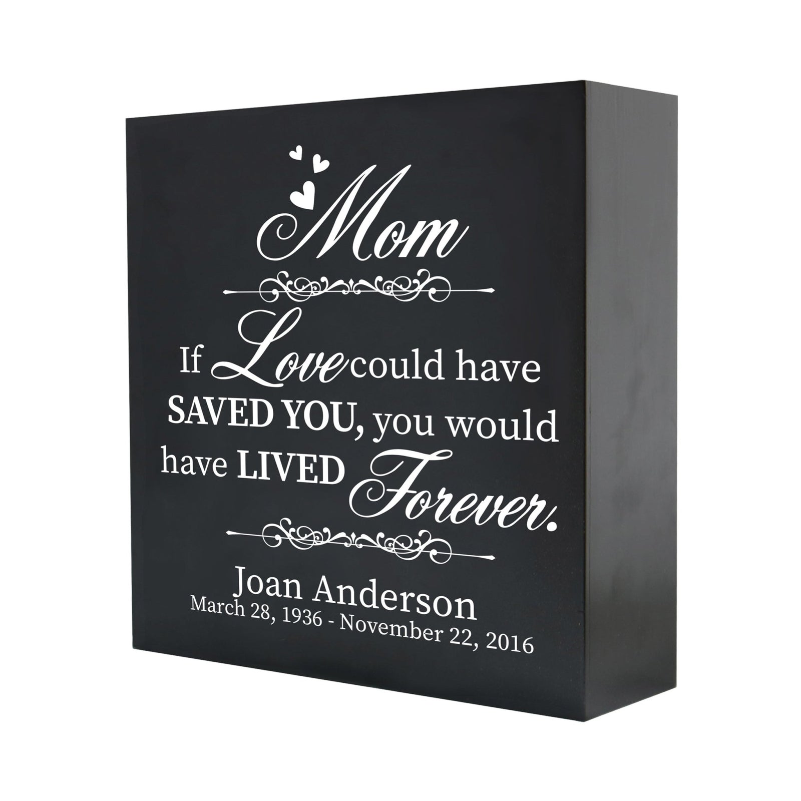 A close-up of a wooden shadow box urn for human ashes, crafted for adults, showcasing its sleek black finish and personalized white text memorializing a mom. The detailed engraving reads, "If love could have saved you, you would have lived forever," offering a touching keepsake.