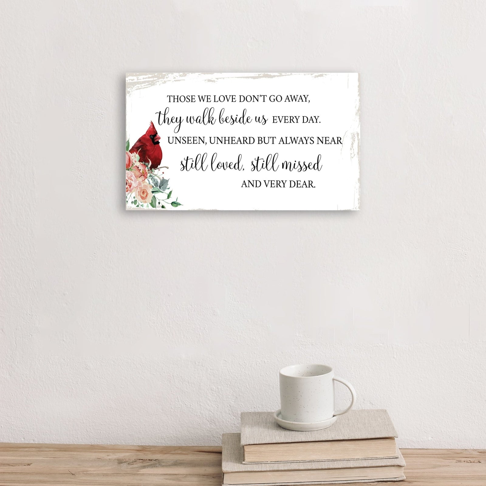 A wooden memorial wall plaque featuring a cardinal, a symbol of remembrance and love.