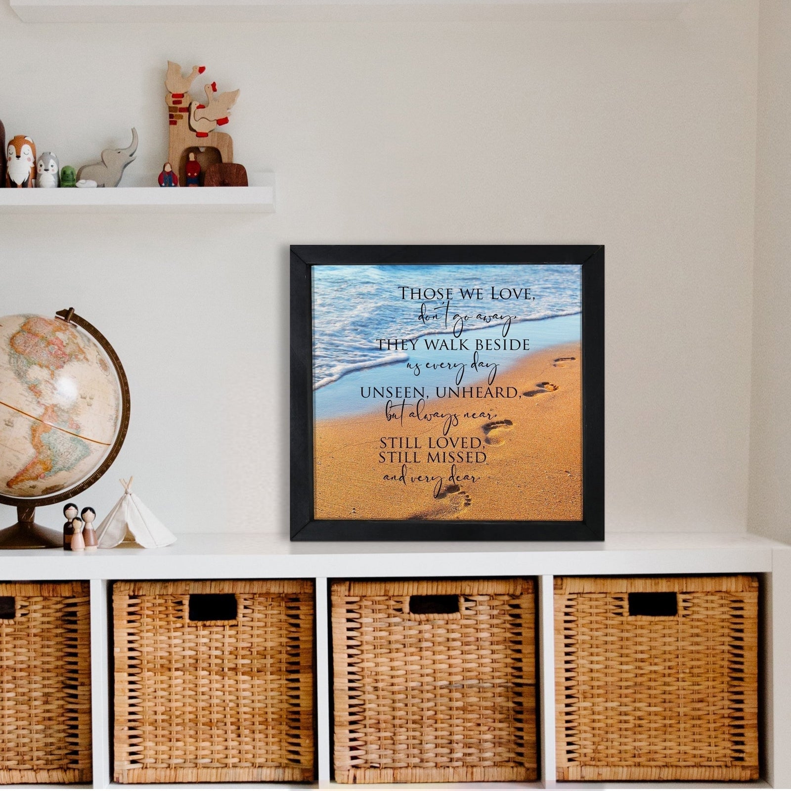 A framed shadow box with a heartfelt memorial tribute inside