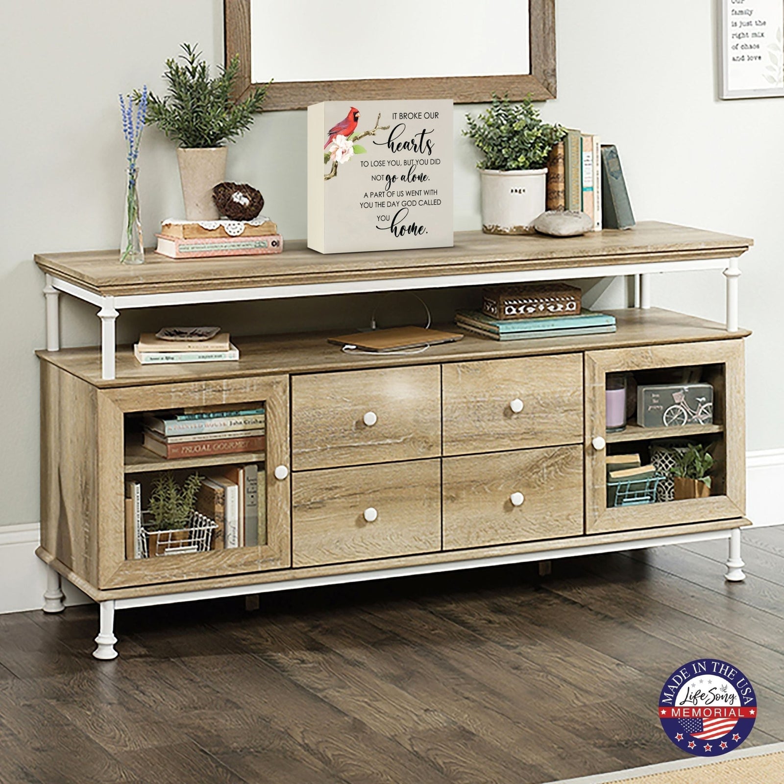 Elegant wooden shadow box urn for human ashes, designed to honor loved one’s memory. The urn is displayed on a rustic wooden console table, surrounded by books, plants, and a warm, inviting decor. Perfect for adult cremation keepsakes, combining functionality with heartfelt design.