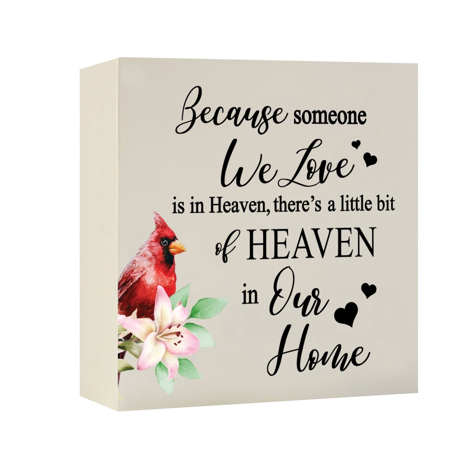 Close-up of a beautiful wooden shadow box urn for human ashes, accented with a red cardinal and white flowers. This adult memorial urn is both a heartfelt tribute and a decorative piece.