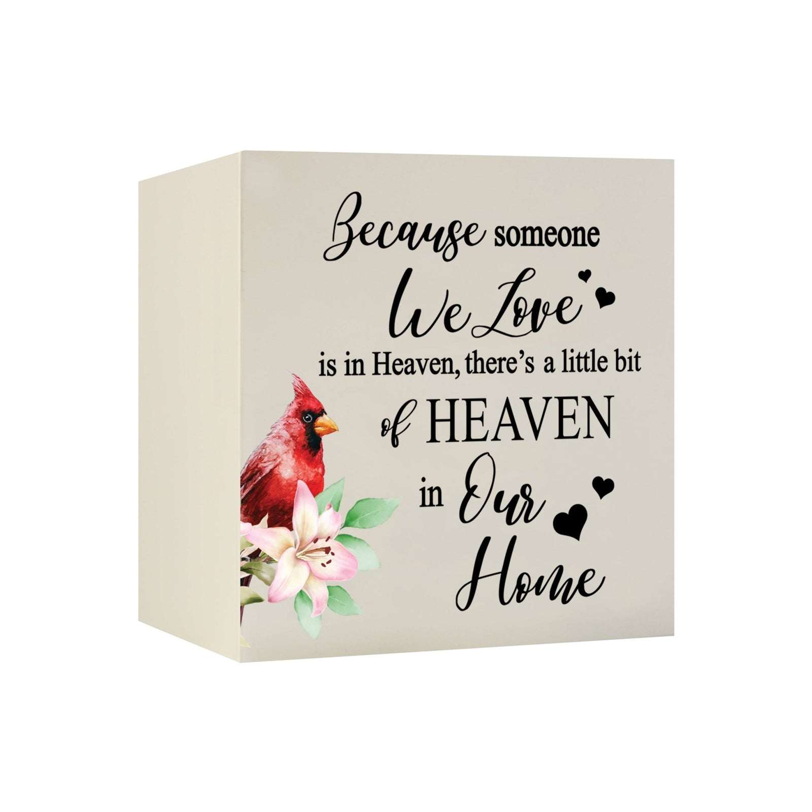 Close-up of a beautiful wooden shadow box urn for human ashes, accented with a red cardinal and white flowers. This adult memorial urn is both a heartfelt tribute and a decorative piece.