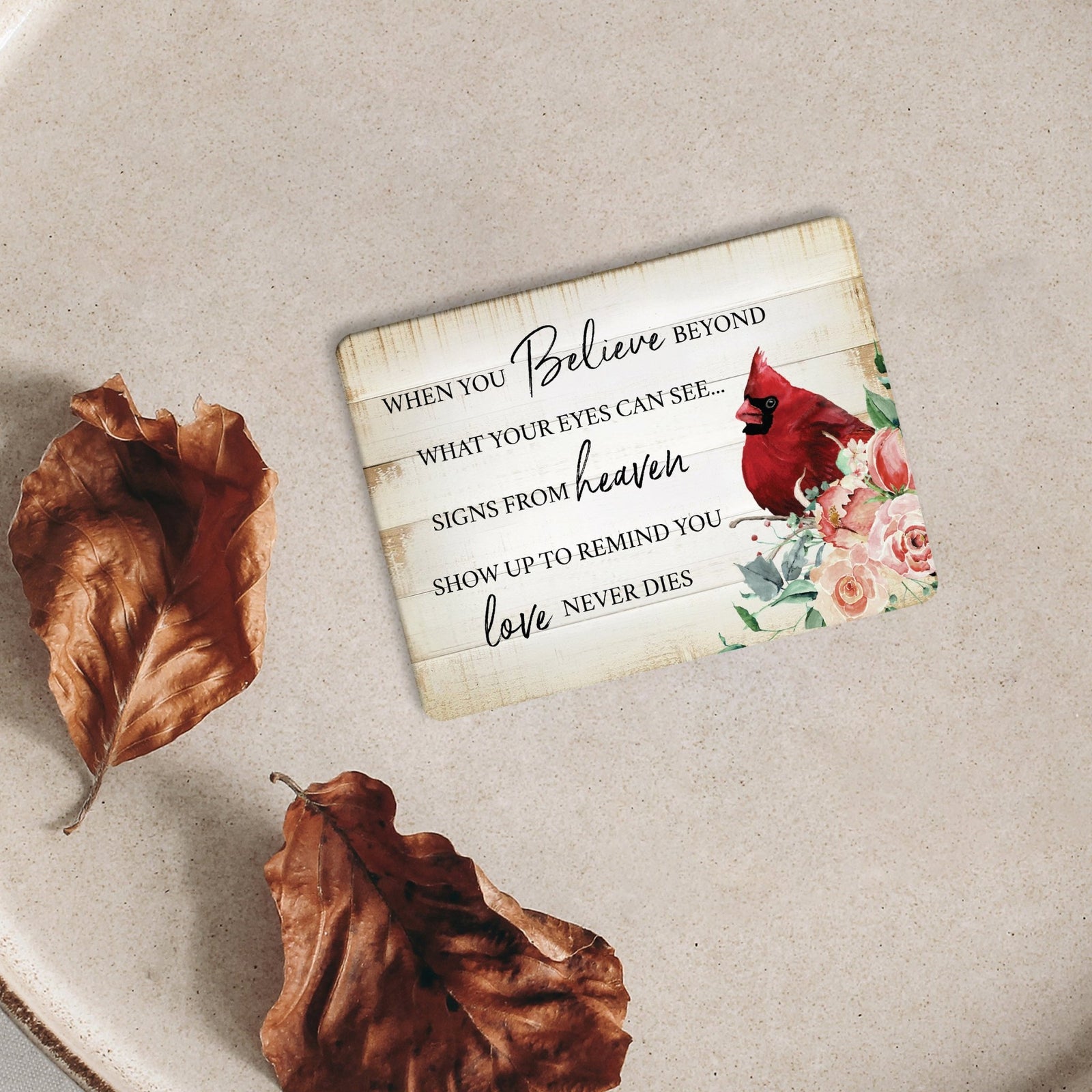 A cardinal magnet that serves as a lasting memorial decoration, offering comfort and solace.