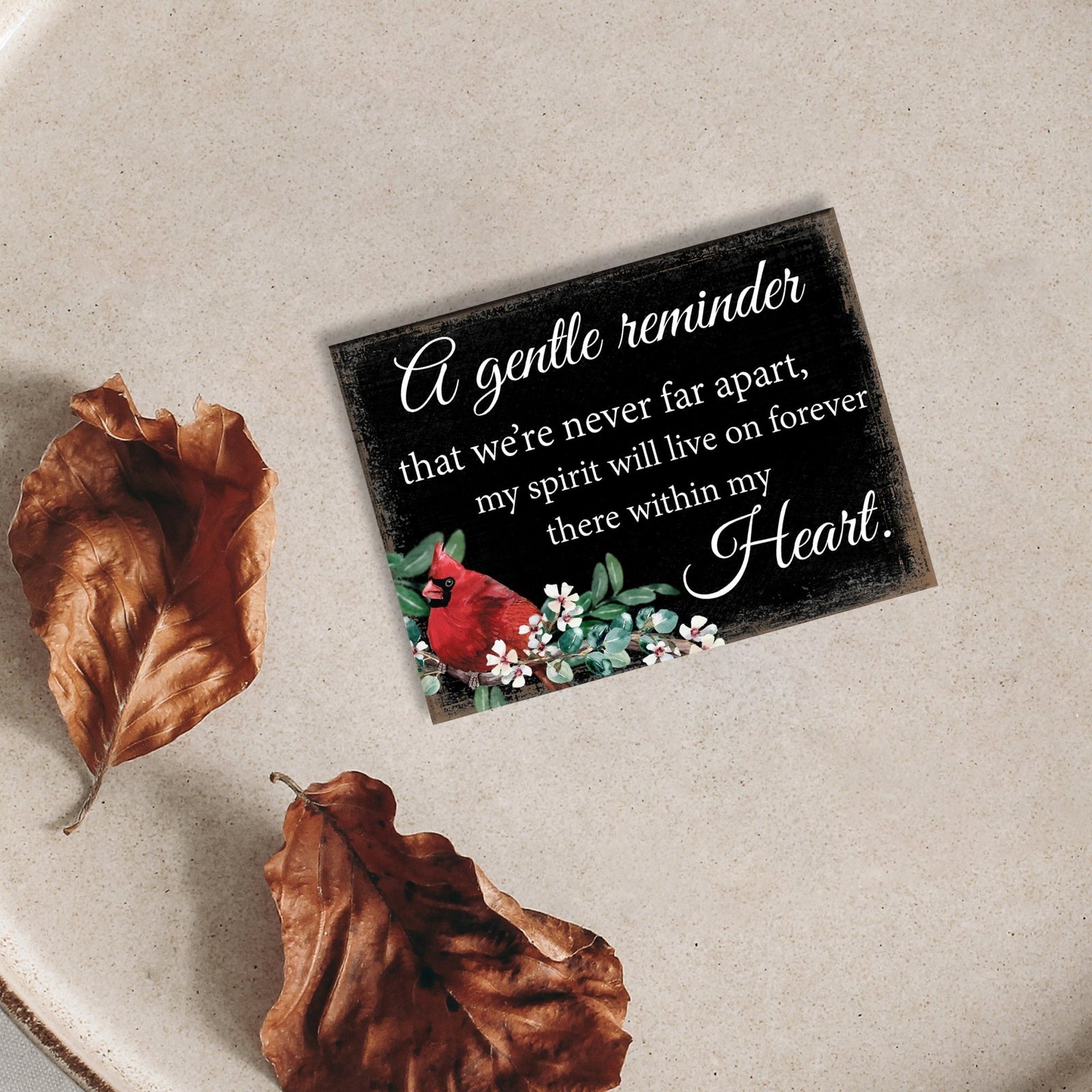A cardinal magnet that serves as a lasting memorial decoration, offering comfort and solace.