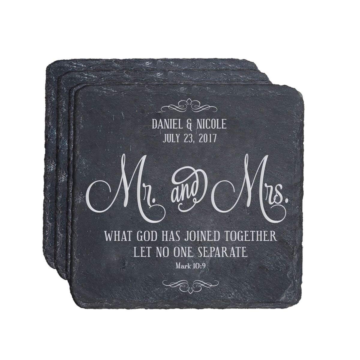 A set of elegant slate coasters with intricate engravings celebrating a wedding anniversary
