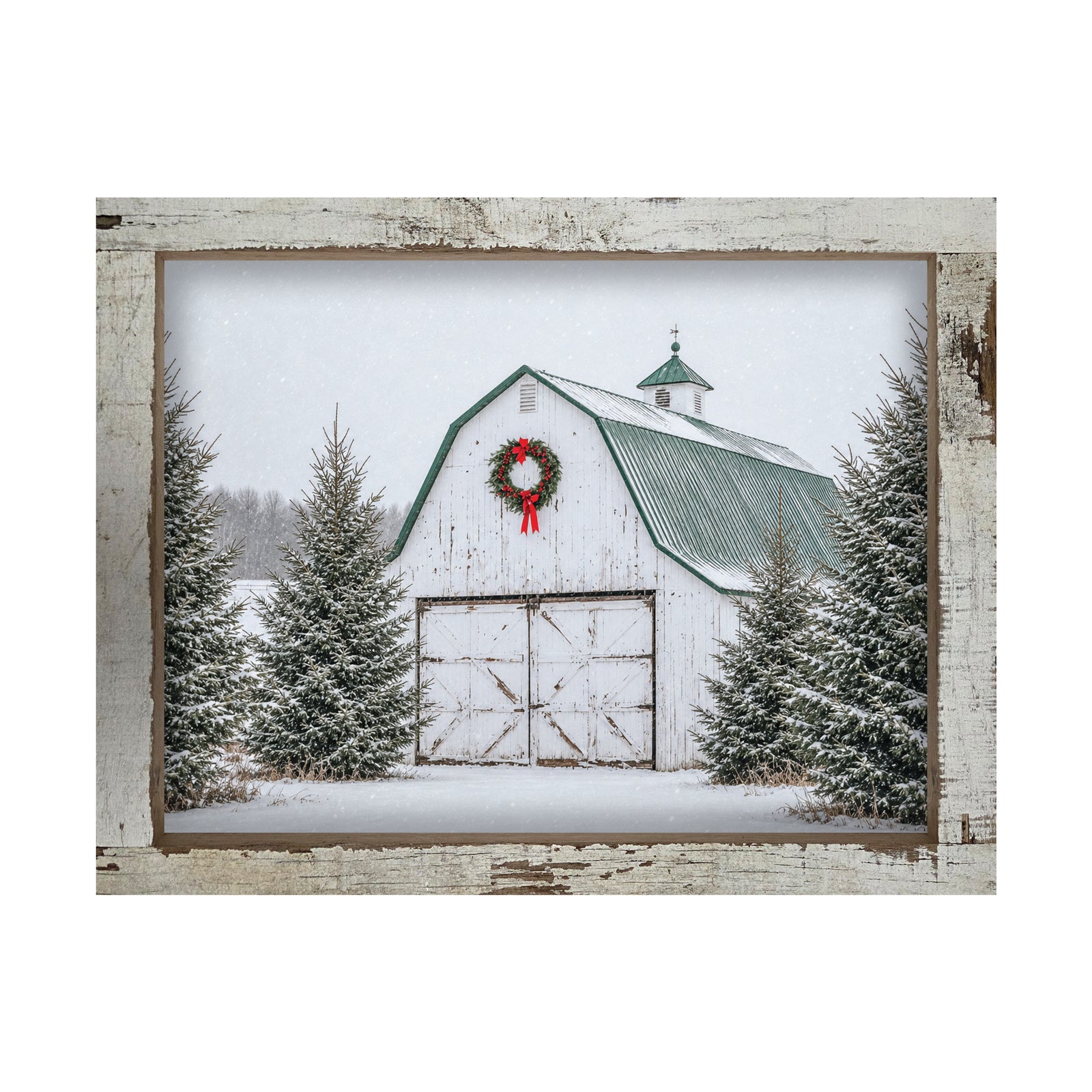 White barn Christmas wall sign with a red-bow wreath, green roof, and snowy spruce trees in a 16 x 16 inch distressed white barnwood frame