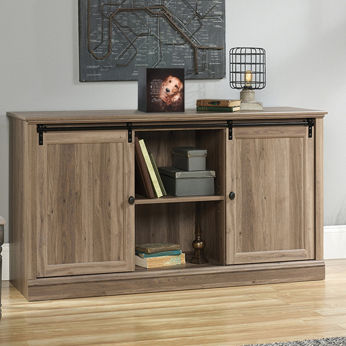 Custom wooden pet urn shadow box displayed on a rustic wooden cabinet in a cozy living room. The personalized pet memorial shadow box features a customized photo of a pet and a heartfelt message. A perfect bereavement keepsake box and sympathy gift for honoring the loss of a beloved pet, blending warmth and sentiment with home décor.