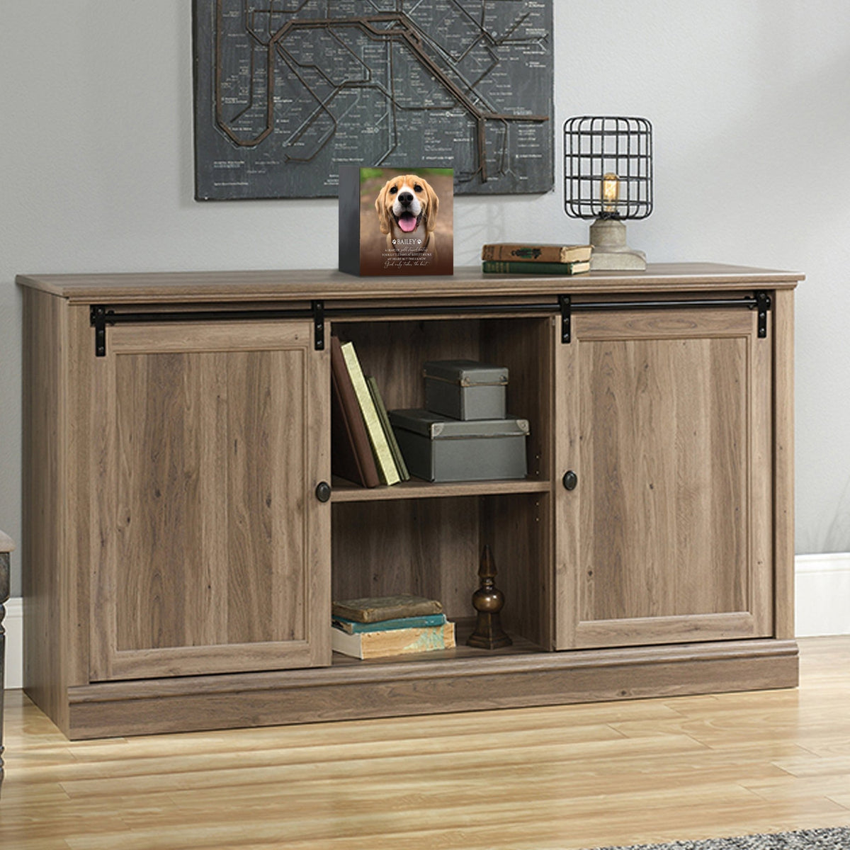 Custom wooden pet urn shadow box displayed on a rustic wooden cabinet in a cozy living room. The personalized pet memorial shadow box features a customized photo of a pet and a heartfelt message. A perfect bereavement keepsake box and sympathy gift for honoring the loss of a beloved pet, blending warmth and sentiment with home décor.