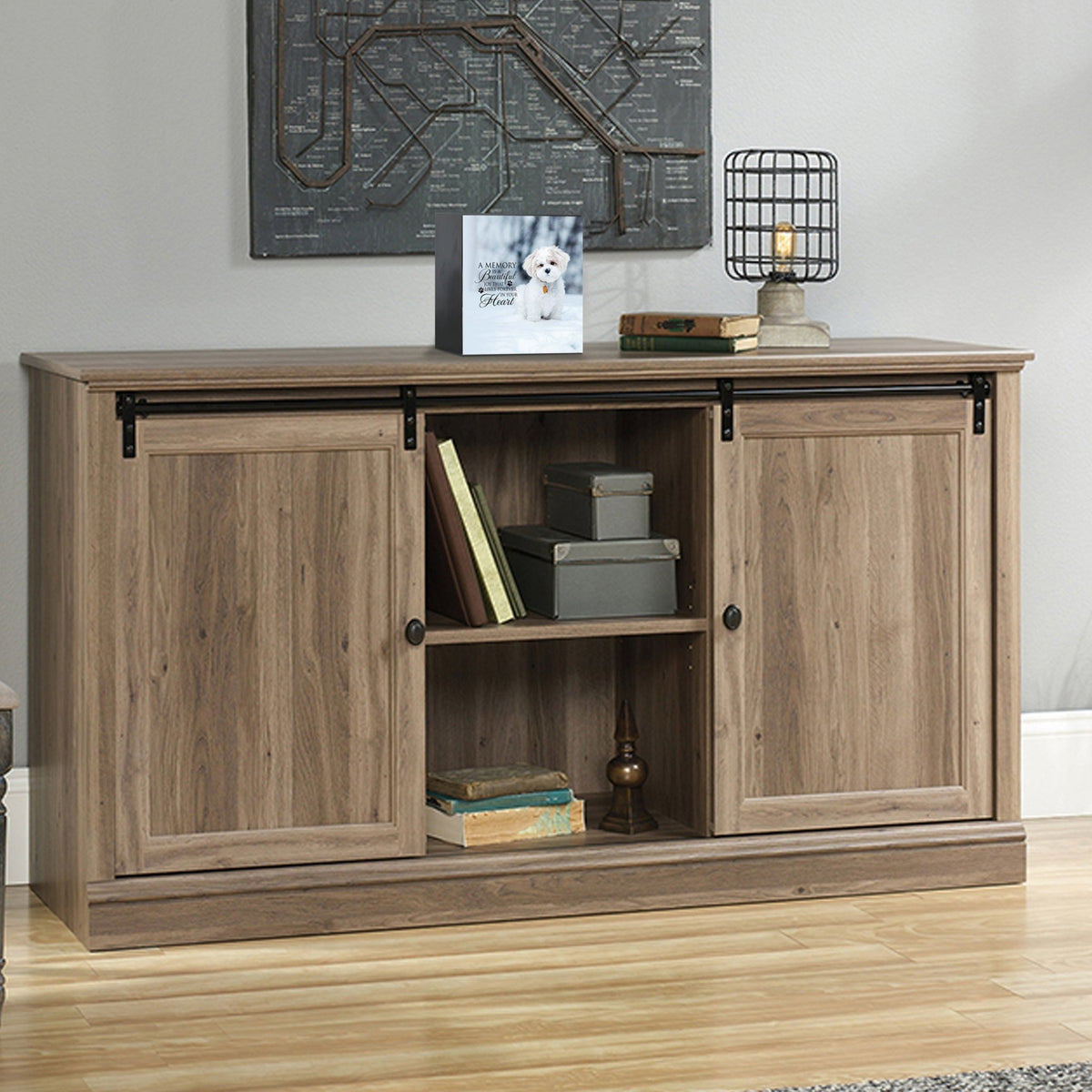 wooden pet urn shadow box displayed on a rustic wooden cabinet in a cozy living room. The pet memorial shadow box features a photo of a pet and a heartfelt message. A perfect bereavement keepsake box and sympathy gift for honoring the loss of a beloved pet, blending warmth and sentiment with home décor.