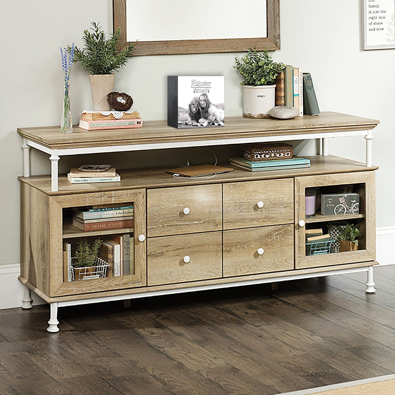 Wooden pet urn shadow box displayed on a rustic wooden TV console in a cozy living room. The shadow box features a custom photo of a pet. A touching bereavement keepsake box ideal for memorial shadow box ideas and personalized pet urns for ashes.