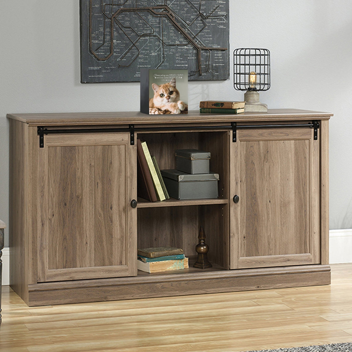 Custom wooden pet urn shadow box displayed on a rustic wooden cabinet in a cozy living room.