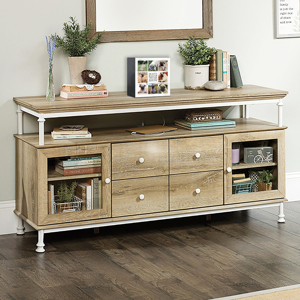 A personalized pet urn placed on a rustic console table.