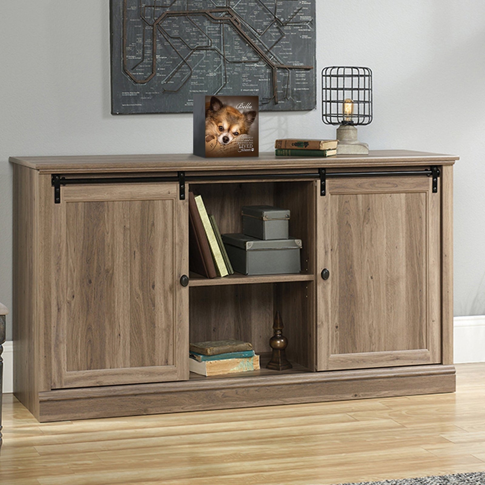 Custom wooden pet urn shadow box displayed on a rustic wooden cabinet in a cozy living room. The personalized pet memorial shadow box features a customized photo of a dog and a heartfelt . A perfect bereavement keepsake box and sympathy gift for honoring the loss of a beloved pet, blending warmth and sentiment with home décor.