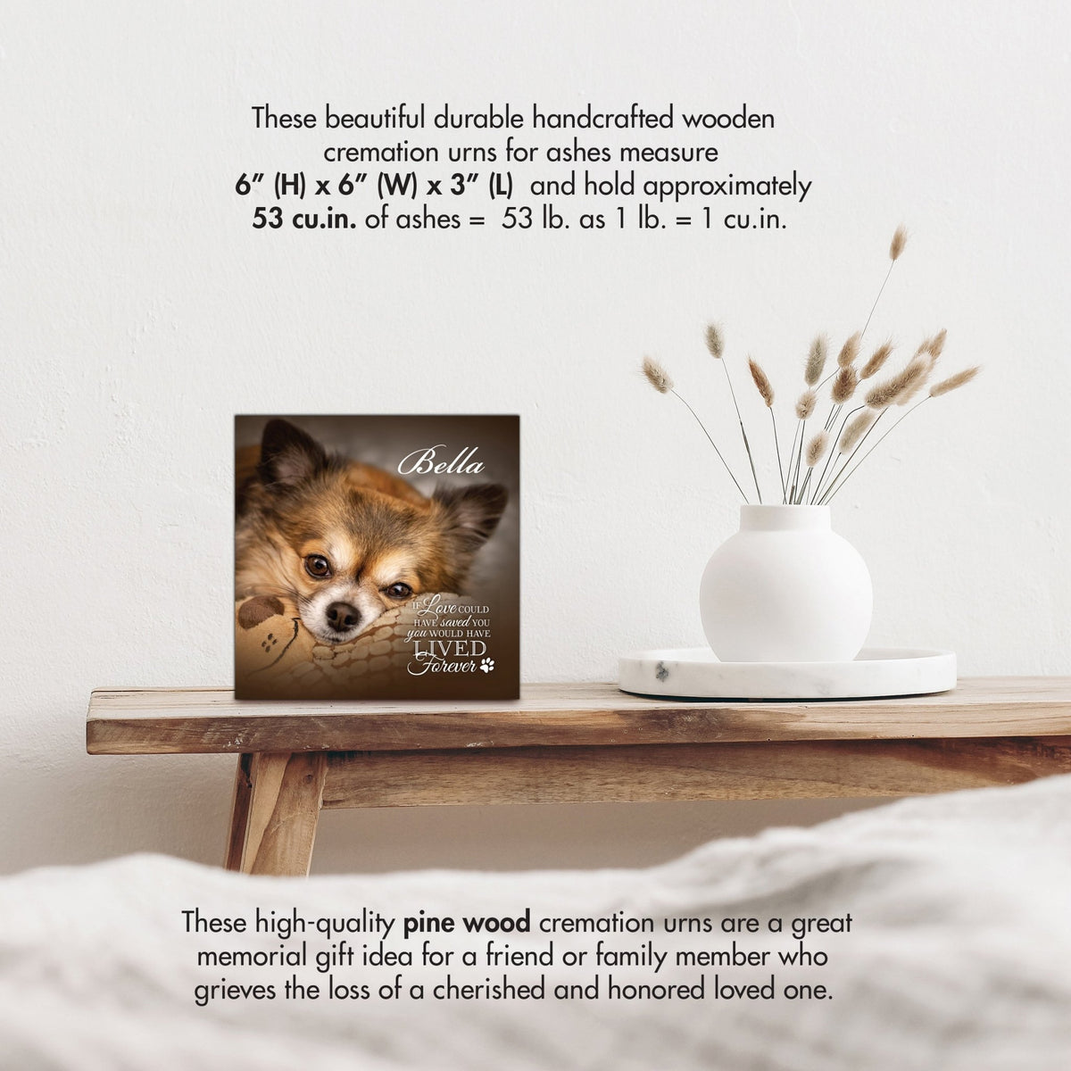 Wooden pet urn shadow box by Lifesong Milestones displayed on a rustic wooden table with a white vase of pampas grass, showcasing a custom photo of Bella with the heartfelt inscription 'If love could have saved you, you would have lived forever.' Ideal for memorial shadow box ideas or personalized pet urns for ashes