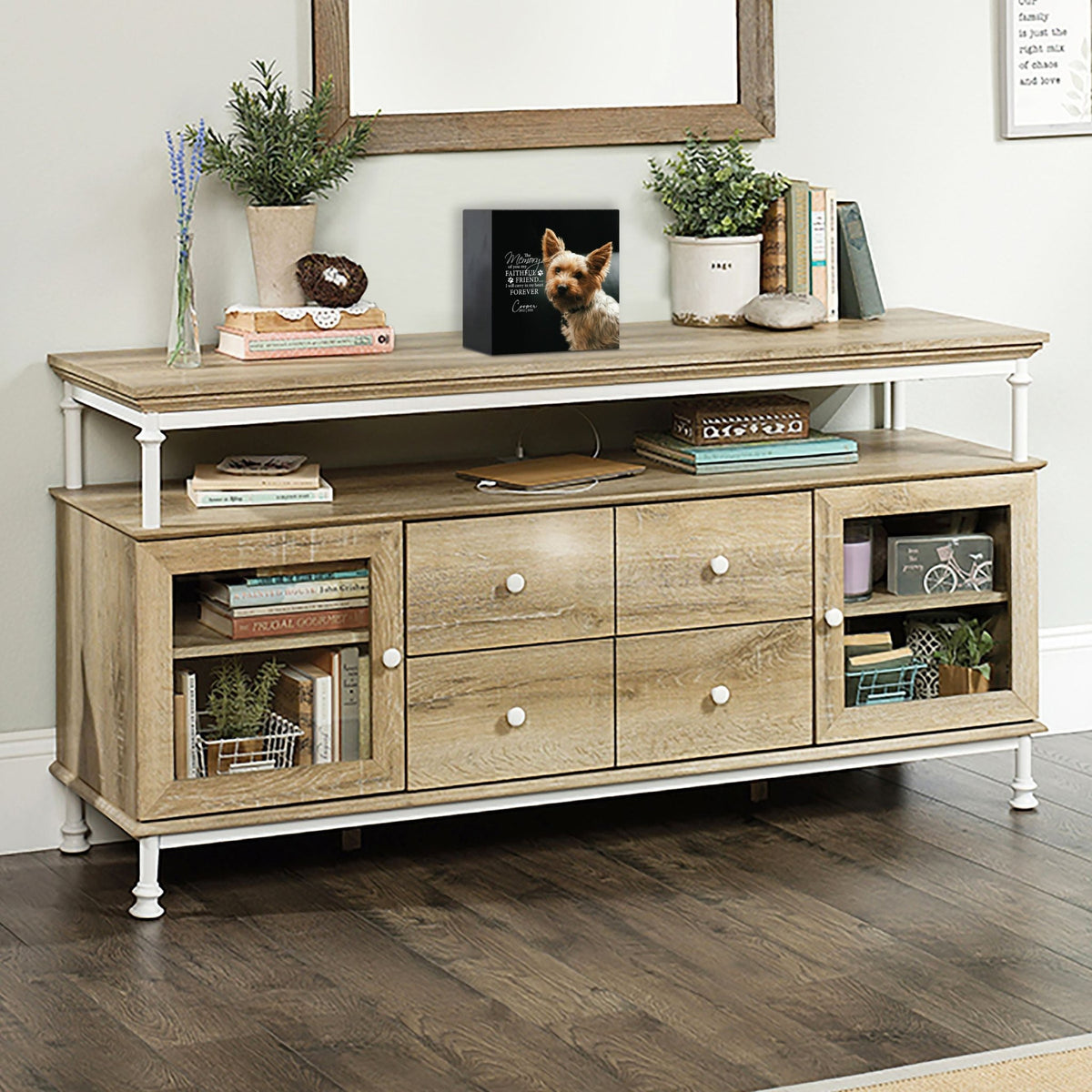 Wooden pet urn shadow box displayed on a rustic wooden TV console in a cozy living room. The shadow box features a custom photo of a pet. A touching bereavement keepsake box ideal for memorial shadow box ideas and personalized pet urns for ashes.