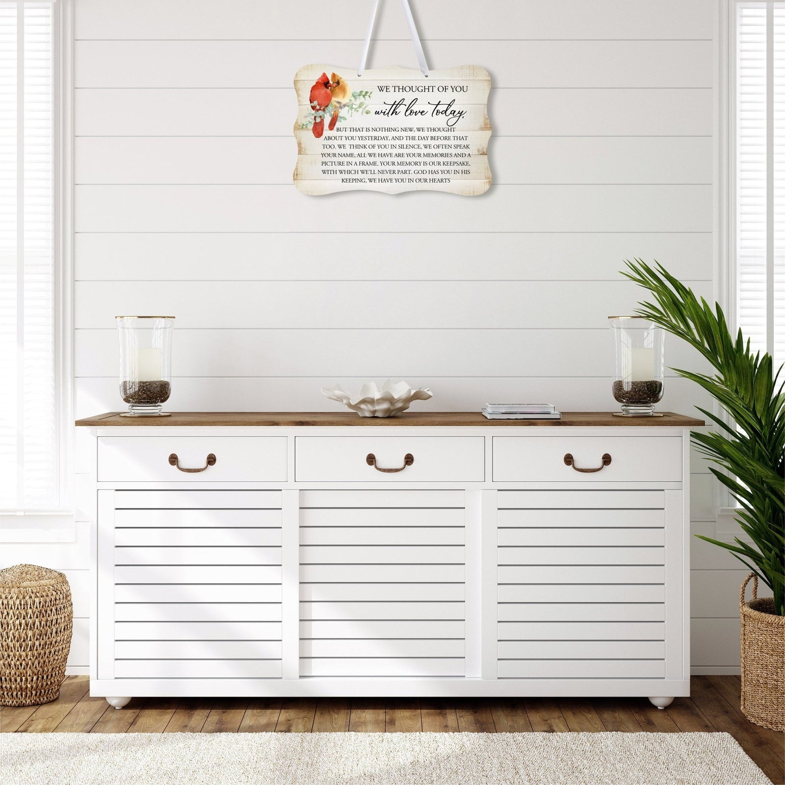 A memorial wall hanging sign adorned with a cardinal ribbon, a symbol of remembrance.