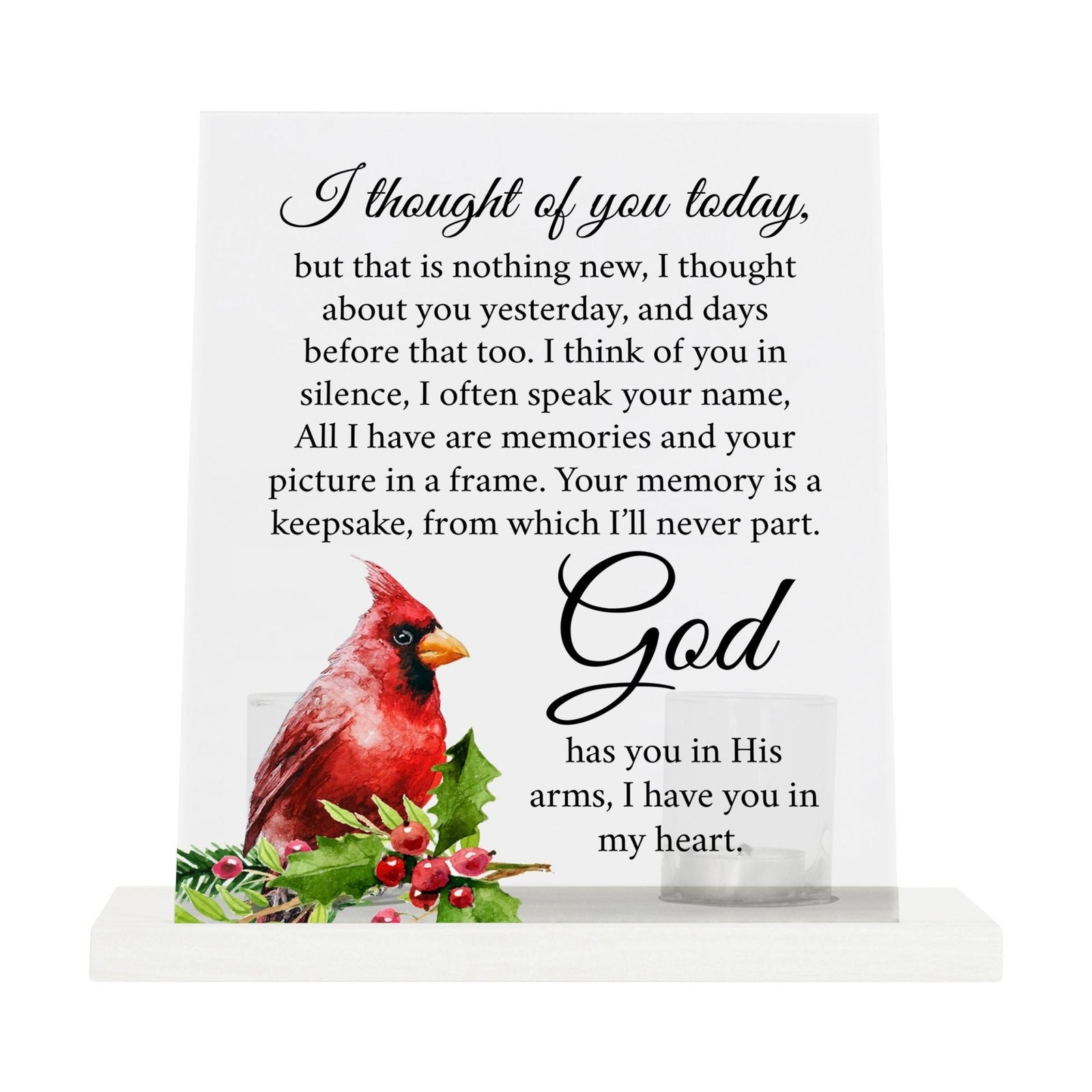 A solemn memorial display featuring a Lifesong Milestones Cardinal Memorial Frosted Acrylic Sign with Base and Votive Candle Holder. The tealight candle holder provides a warm glow, while votive candles surround it, creating a touching memory.