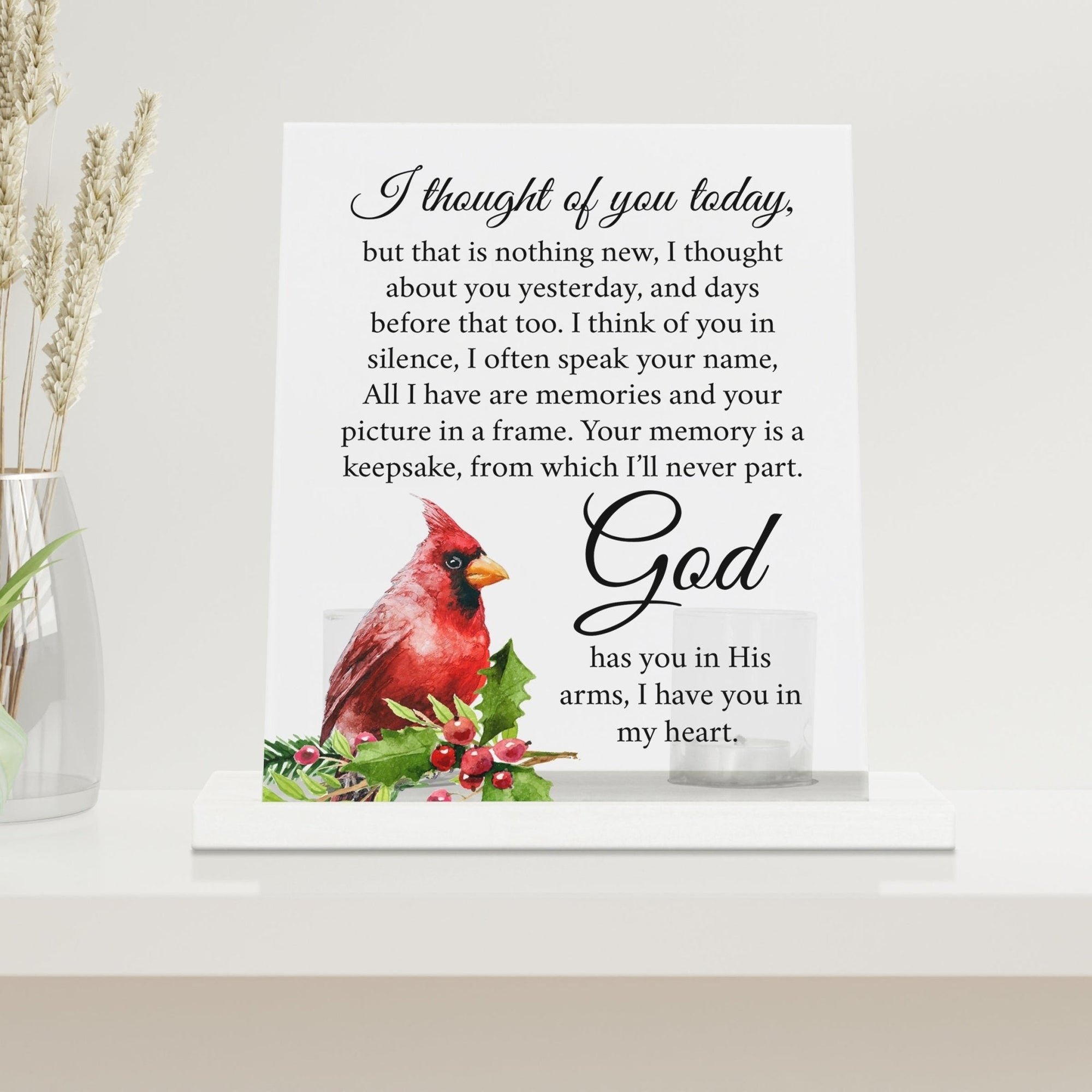 A beautifully crafted candle holder for votive candles, designed as a memorial gift. The Lifesong Milestones Cardinal Memorial Frosted Acrylic Sign with Base stands at the center, radiating comfort and remembrance.
