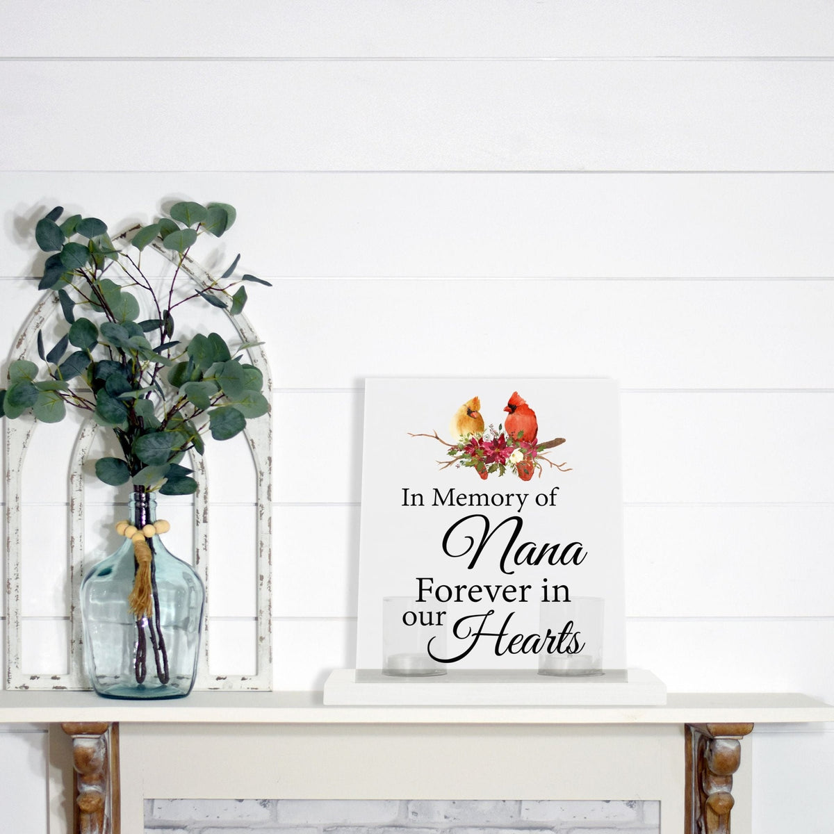 A beautifully crafted candle holder for votive candles, designed as a memorial gift. The Lifesong Milestones Cardinal Memorial Frosted Acrylic Sign with Base stands at the center, radiating comfort and remembrance.
