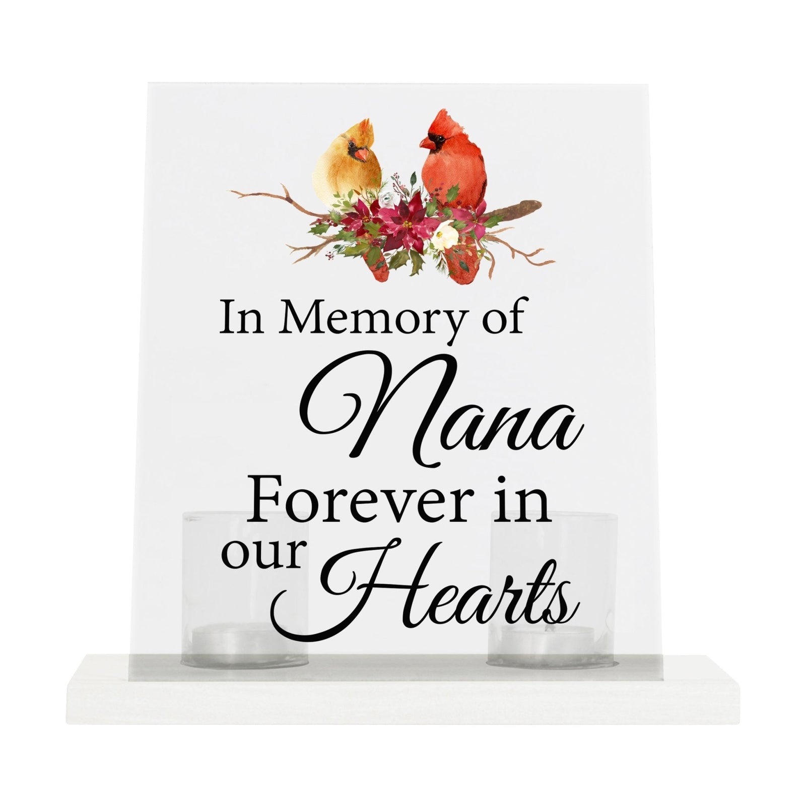 A solemn memorial display featuring a Lifesong Milestones Cardinal Memorial Frosted Acrylic Sign with Base and Votive Candle Holder. The tealight candle holder provides a warm glow, while votive candles surround it, creating a touching memory.