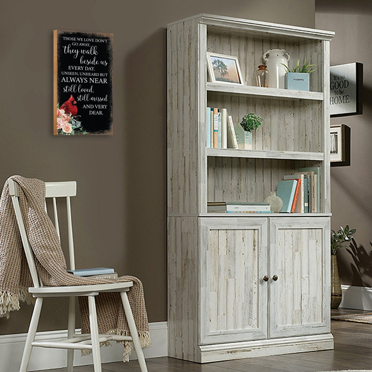 A wooden memorial wall plaque featuring a cardinal, a symbol of remembrance and love.